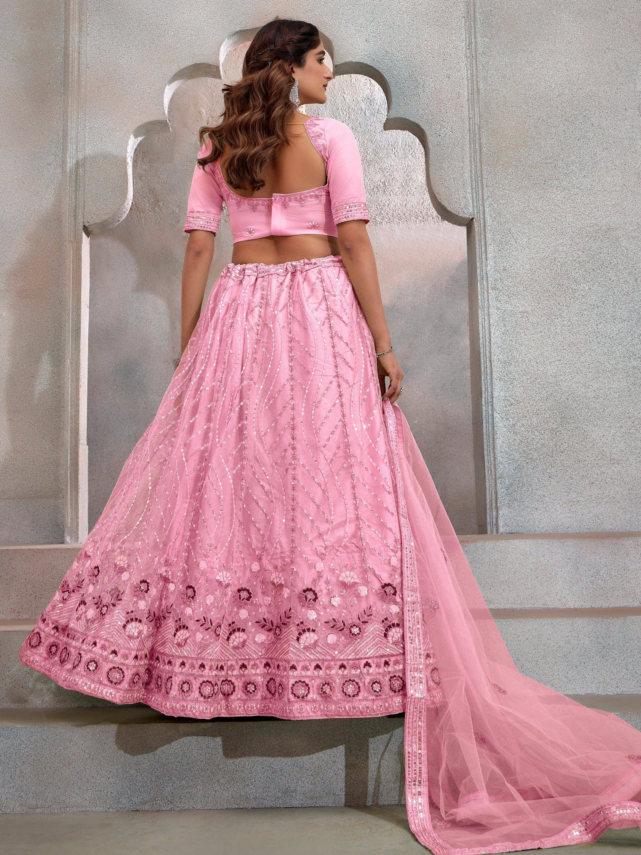 Pink embroidered lehenga choli with floral motifs and sequin detailing, perfect for Indian ethnic wear occasions.