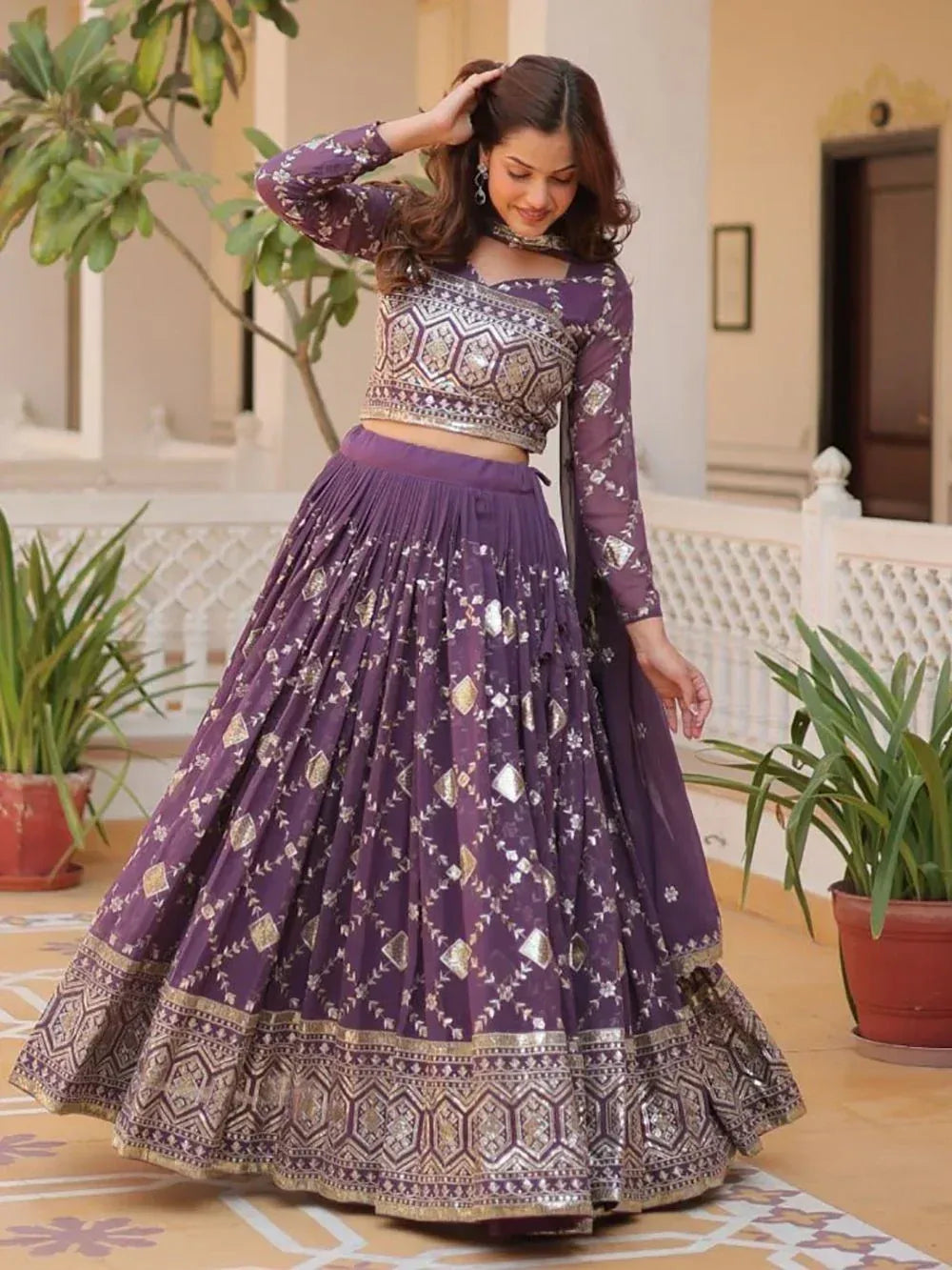 Purple embroidered lehenga choli with gold detailing, perfect for Indian ethnic wear occasions