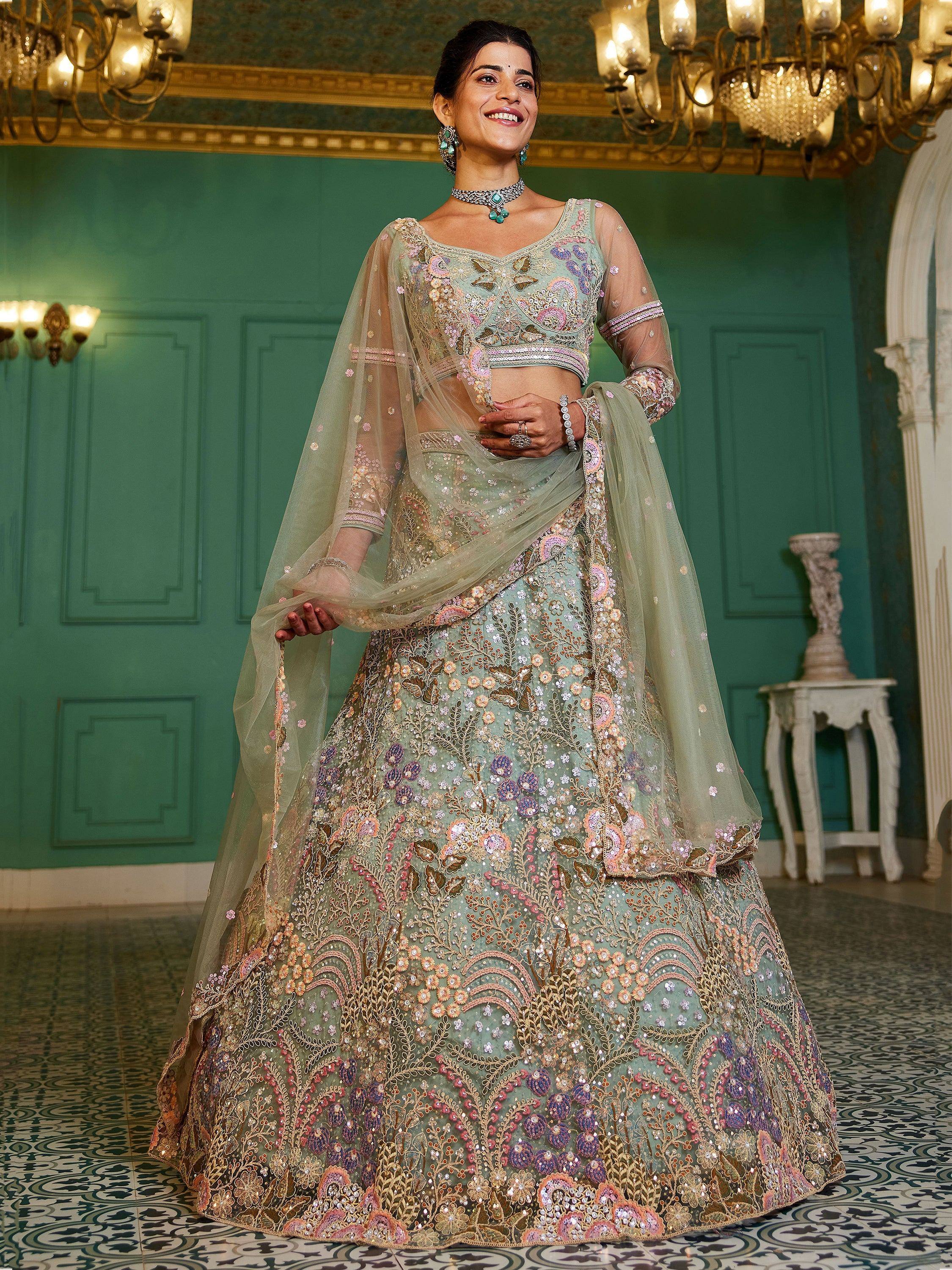 Elegant mint green lehenga choli with floral embroidery and sheer dupatta, perfect for Indian weddings and festive occasions.