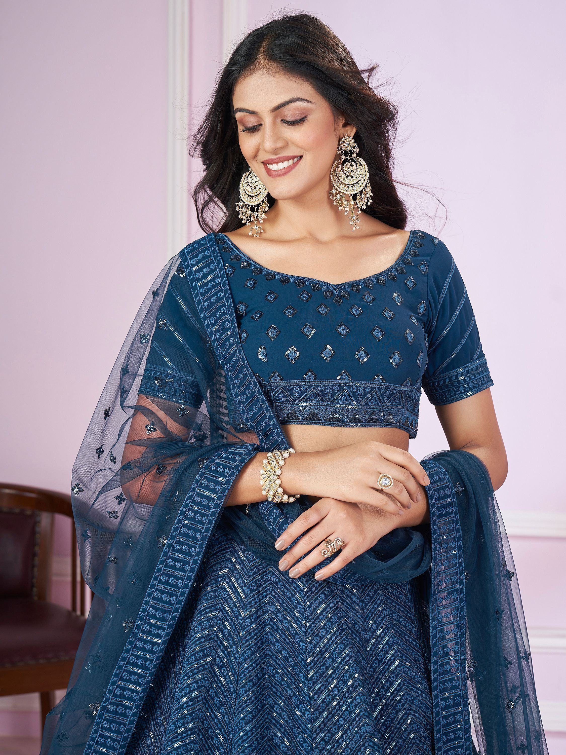 Blue embroidered lehenga choli with sheer dupatta, perfect for Indian ethnic wear and festive occasions.
