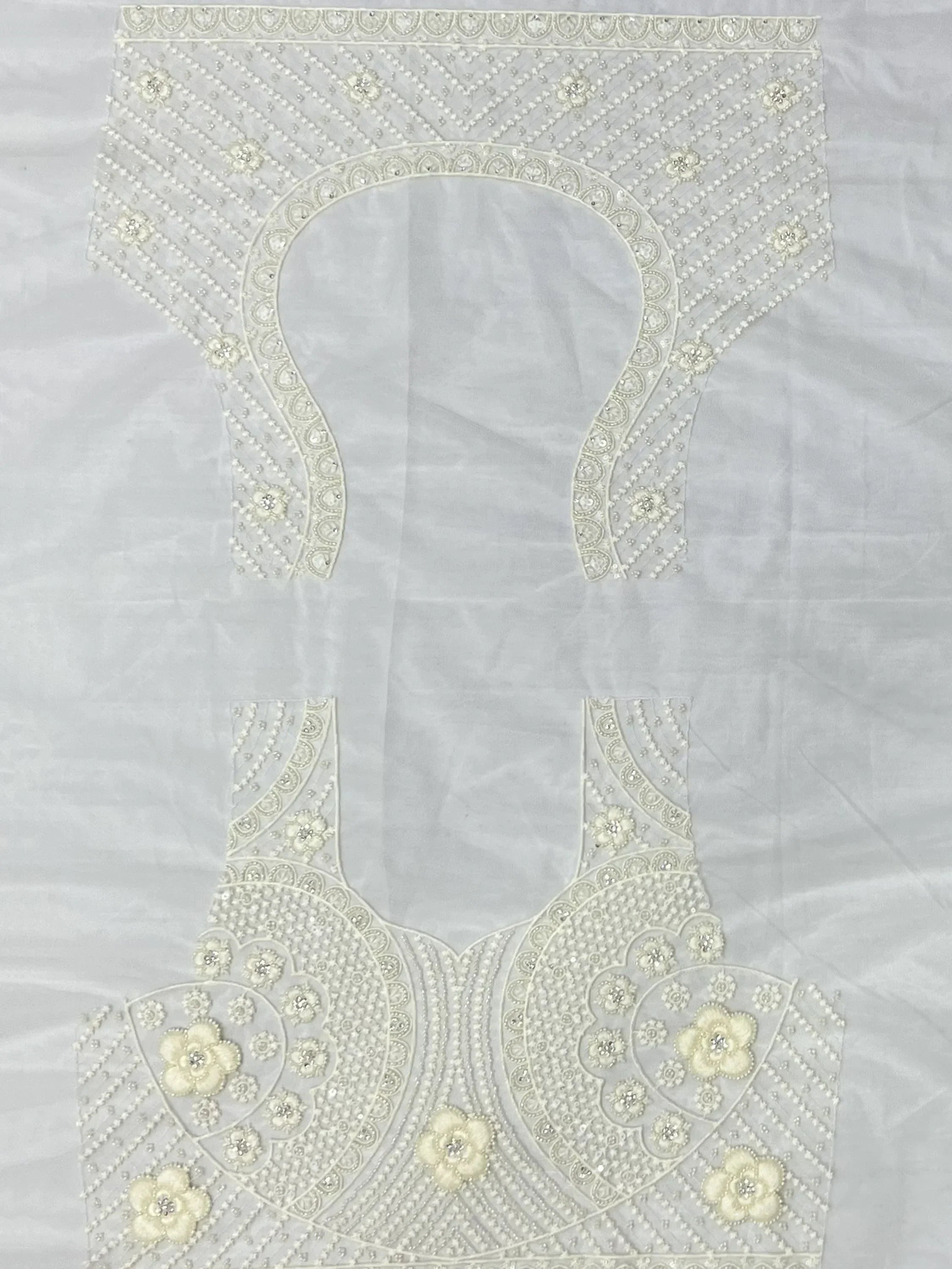 White embroidered lehenga choli blouse with floral beadwork and pearl detailing for Indian ethnic wear