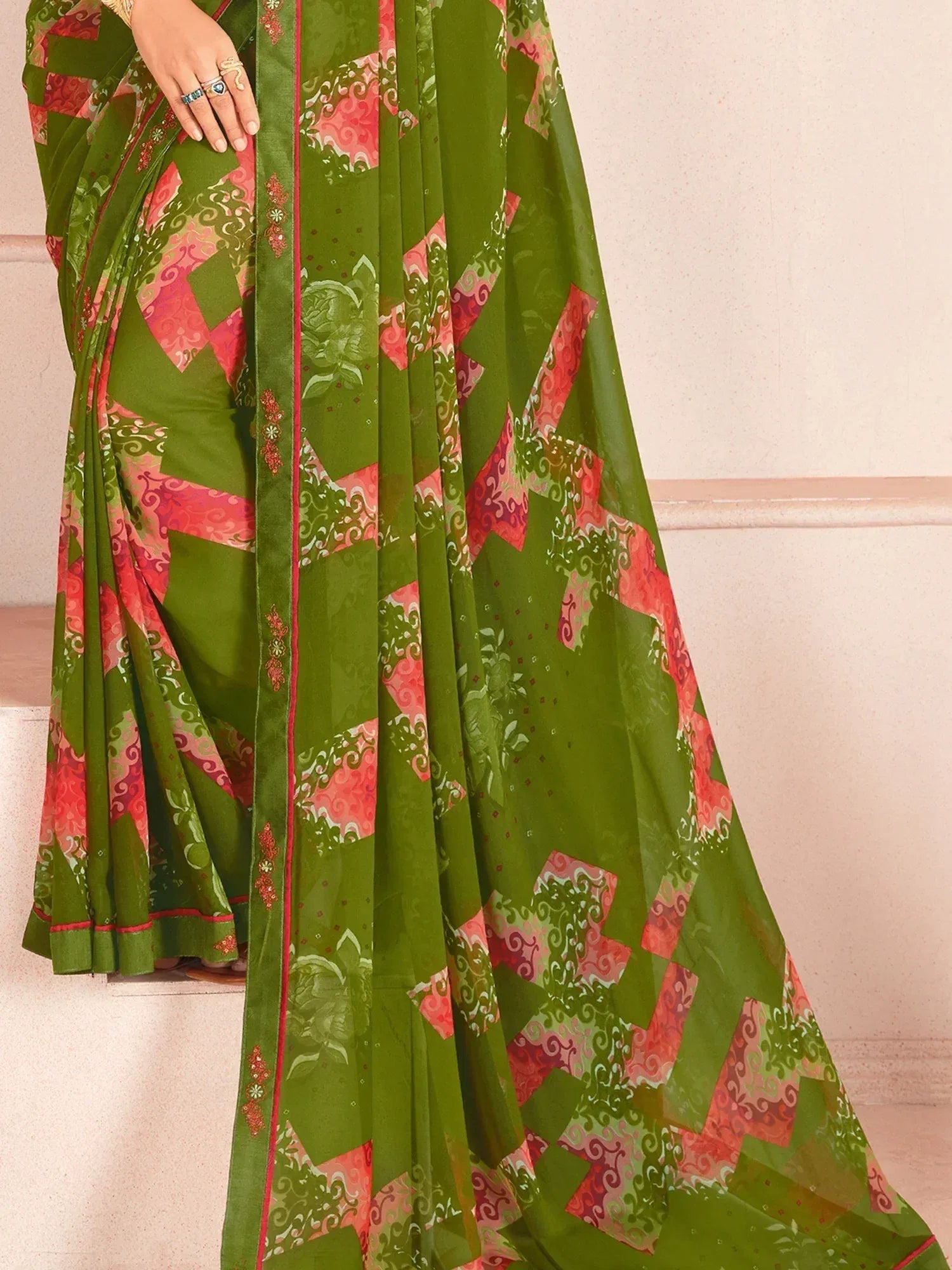 Green and pink printed saree with floral and geometric patterns, ideal for ethnic wear occasions