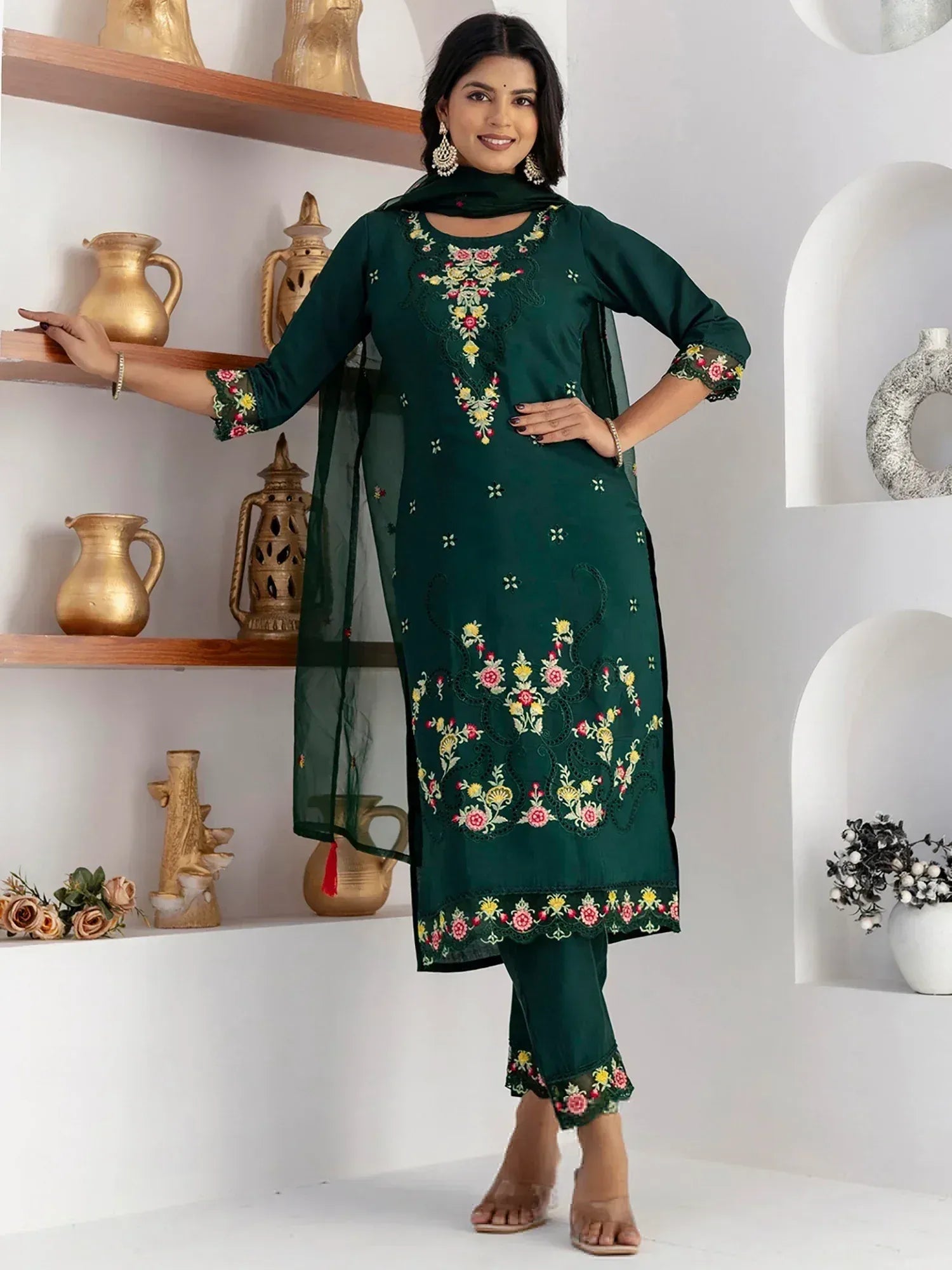 Emerald green embroidered salwar kameez with floral design and matching dupatta, ideal for ethnic wear occasions.