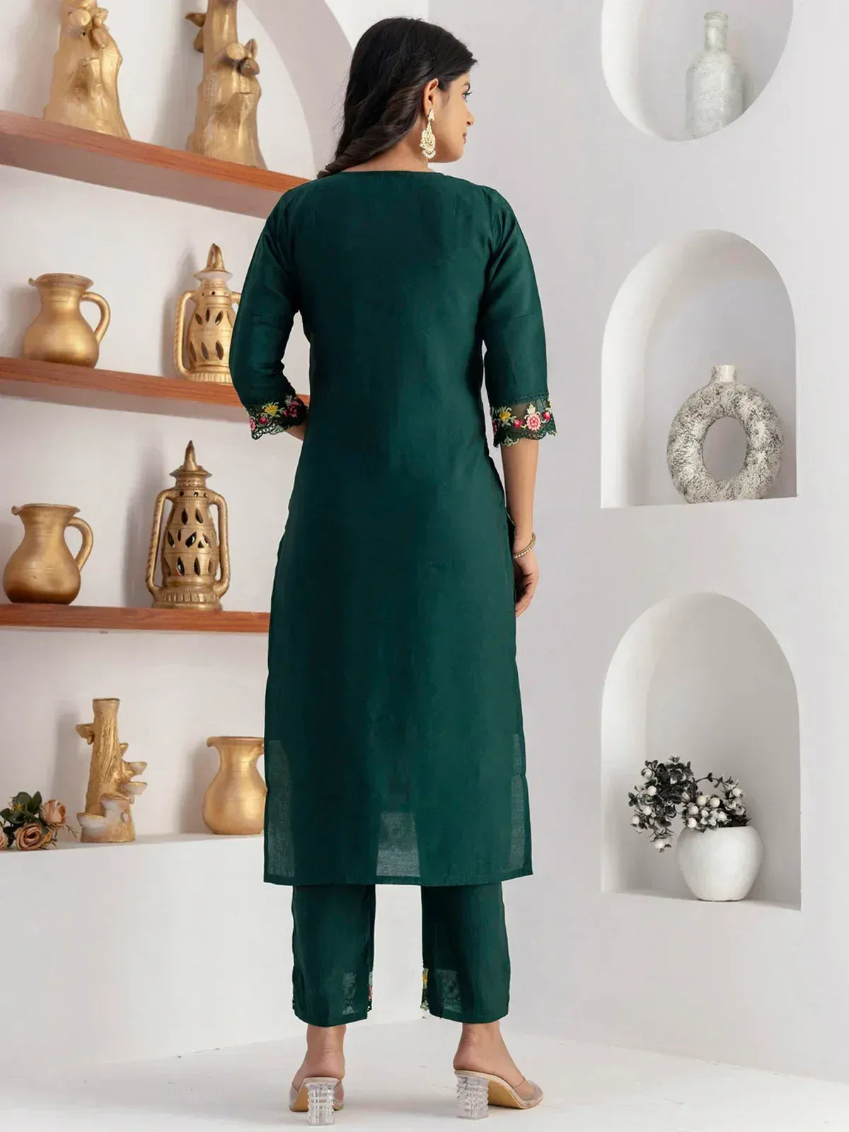 Emerald green embroidered kurta with matching pants, floral lace cuffs, stylish ethnic wear for women