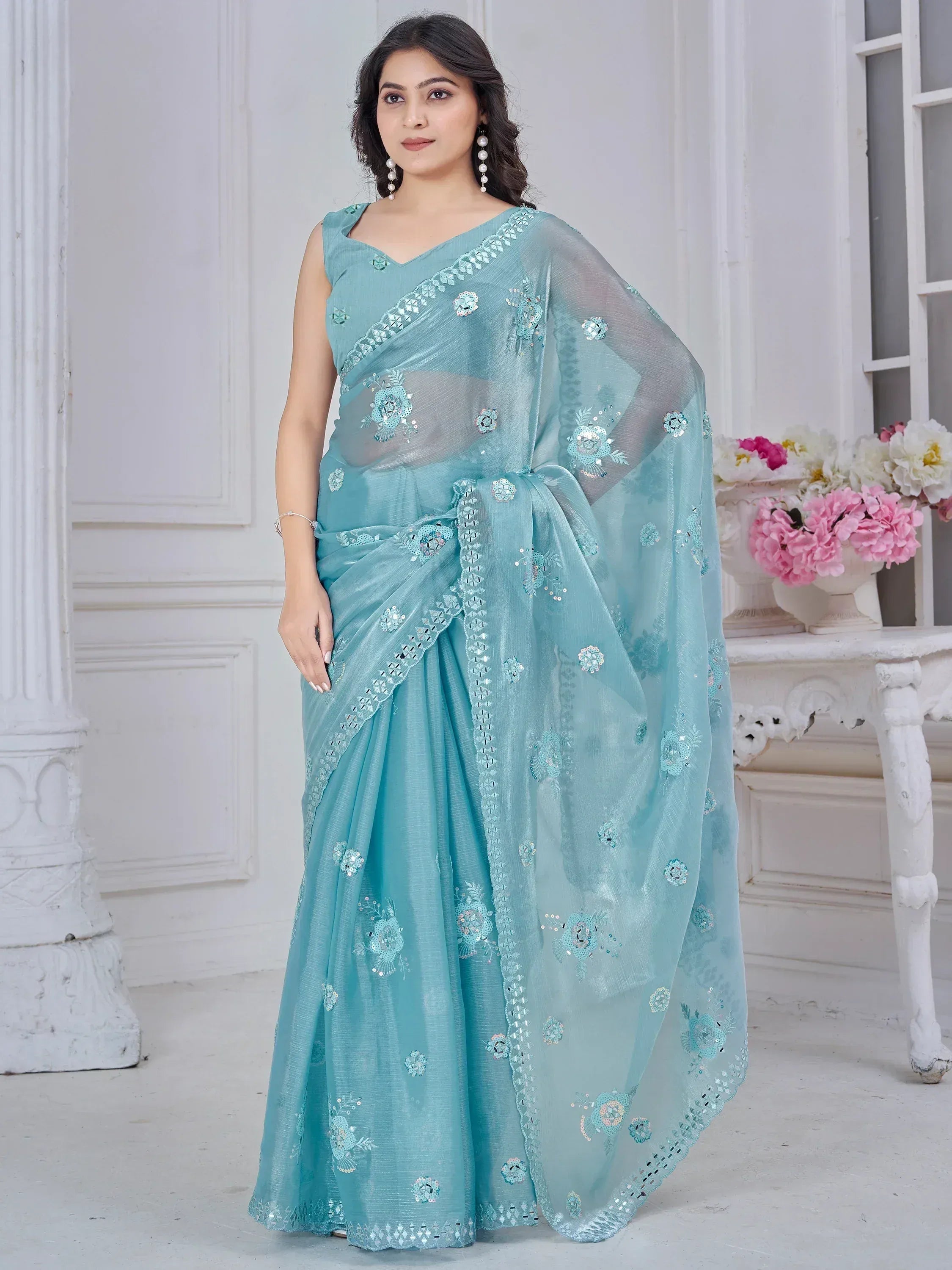 Light blue embroidered saree with sequin floral motifs, perfect for Indian ethnic occasions