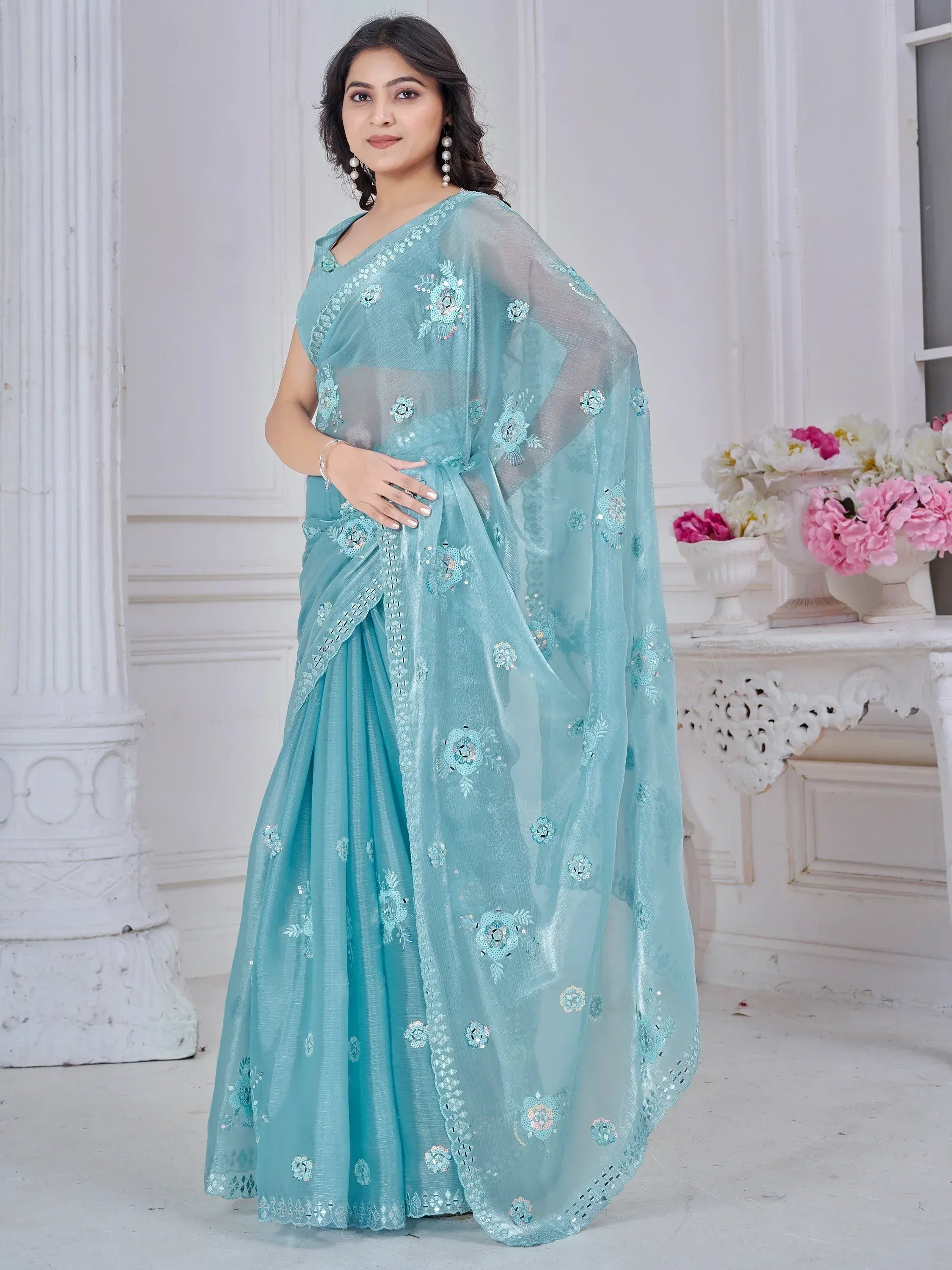 Elegant light blue saree with floral embroidery and sequin work, perfect for Indian ethnic occasions.