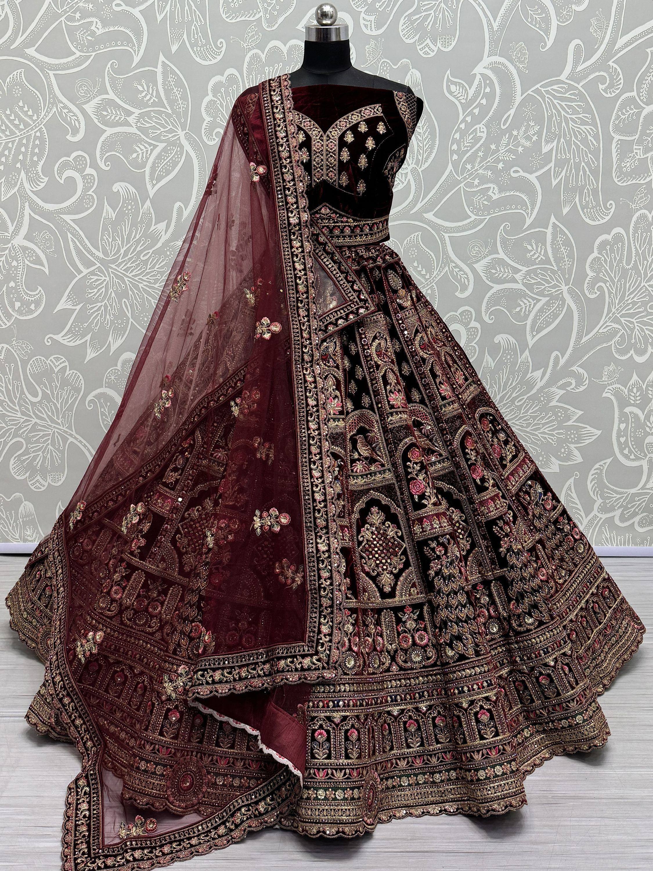 Maroon velvet designer lehenga choli with heavy gold embroidery and matching dupatta, ethnic Indian wear