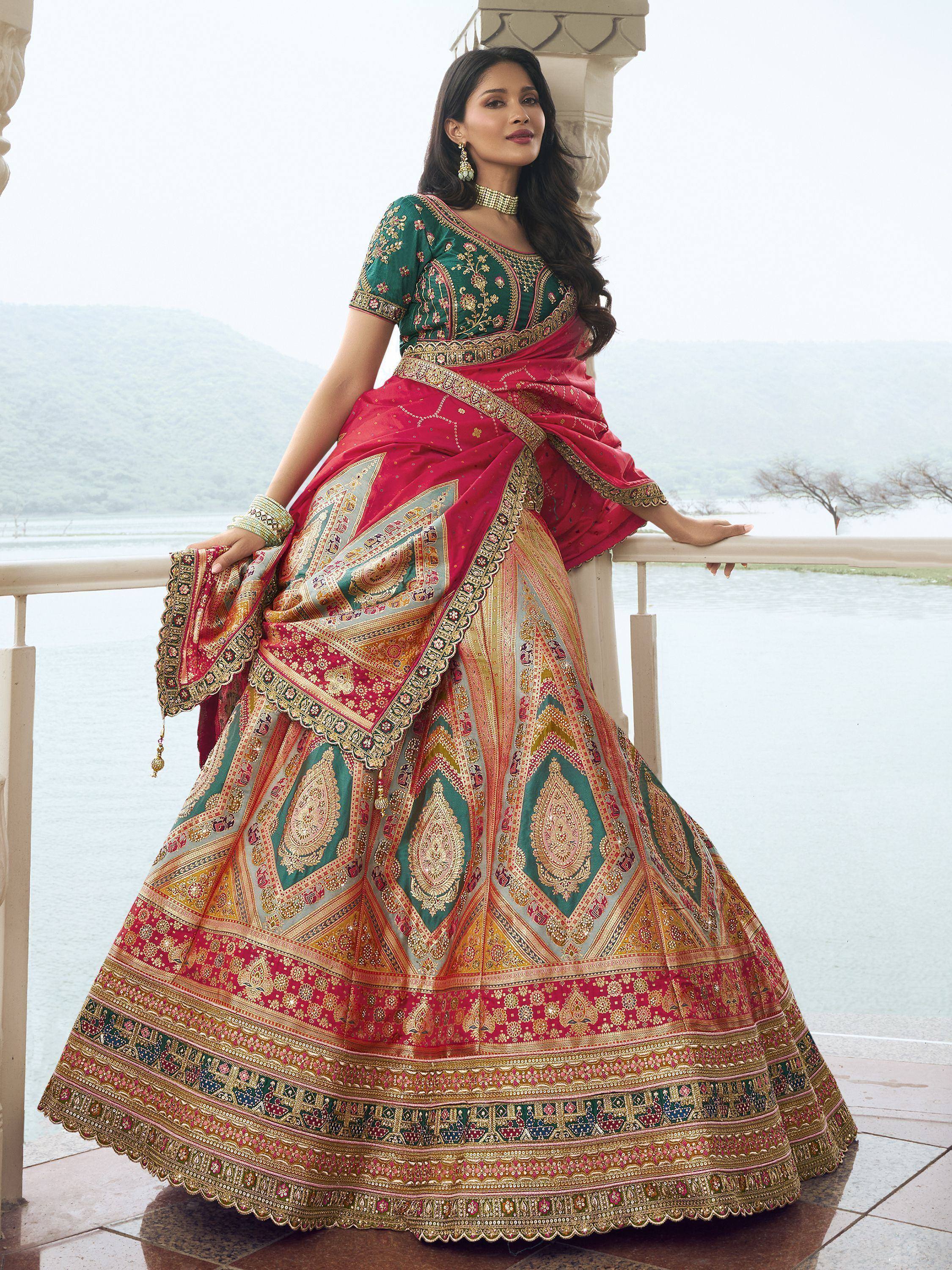 Woman in vibrant Indian lehenga choli with intricate embroidery, standing by lakeside balcony