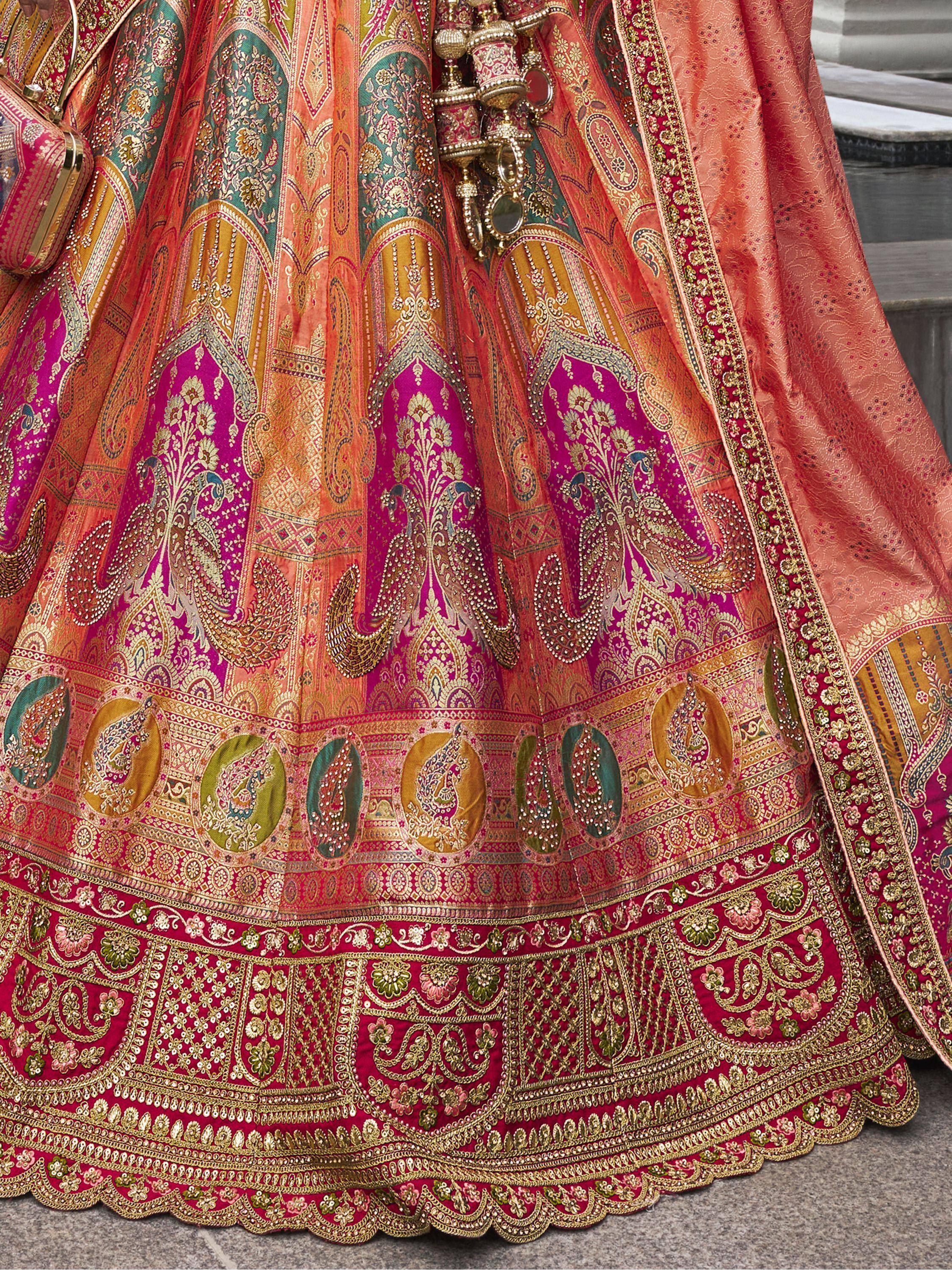 Designer lehenga choli with intricate paisley embroidery and vibrant Indian ethnic wear details