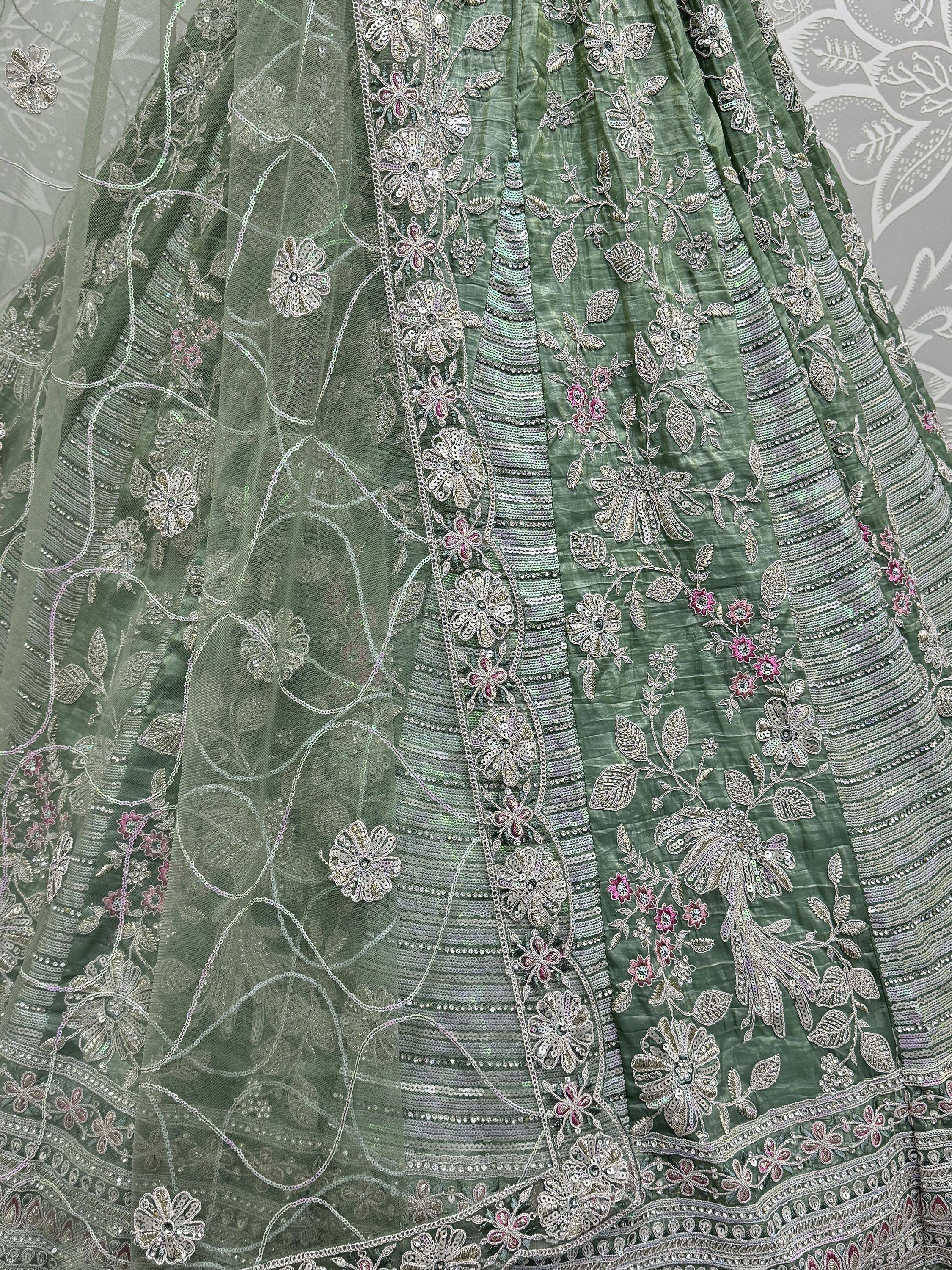 Green embroidered lehenga with floral sequin work and sheer overlay, perfect for Indian ethnic wear