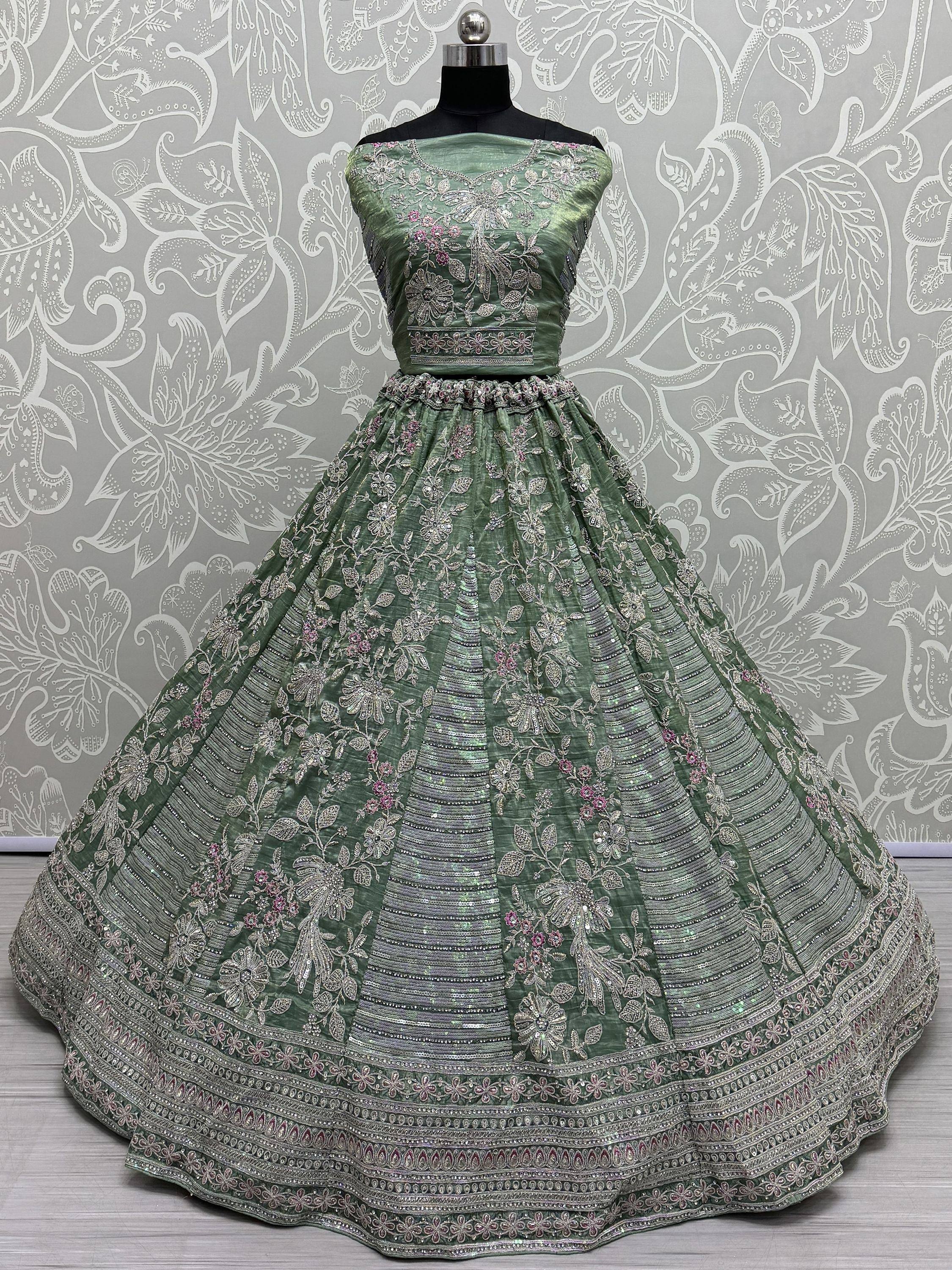 Green embroidered lehenga choli with floral zari work, perfect for Indian weddings and festive occasions