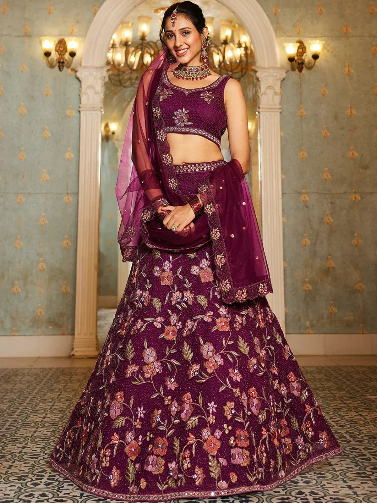 Elegant purple floral embroidered lehenga choli with matching dupatta, perfect for Indian weddings and festive occasions.