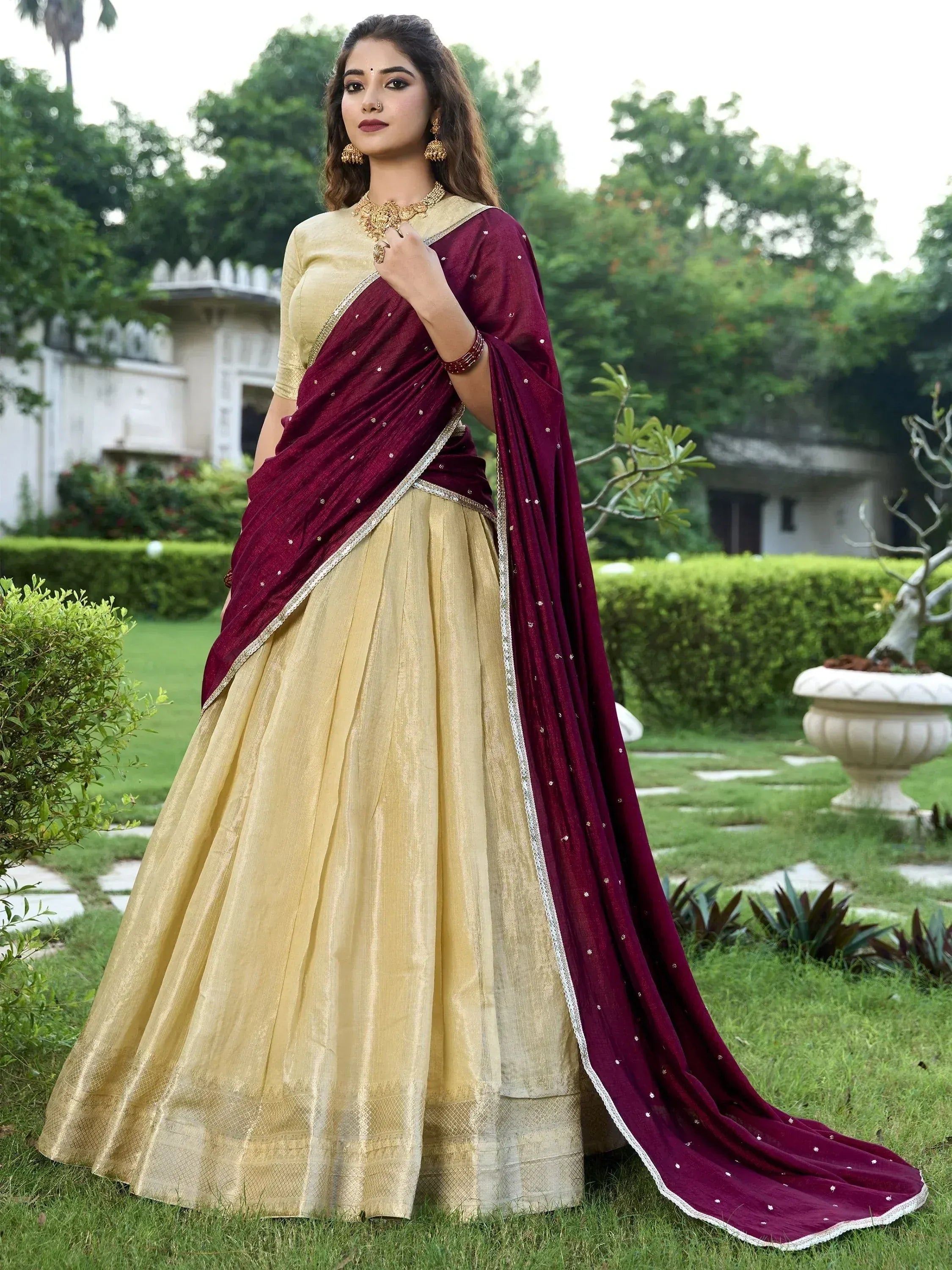 Maroon and gold designer lehenga choli with embroidered dupatta, perfect for Indian ethnic occasions