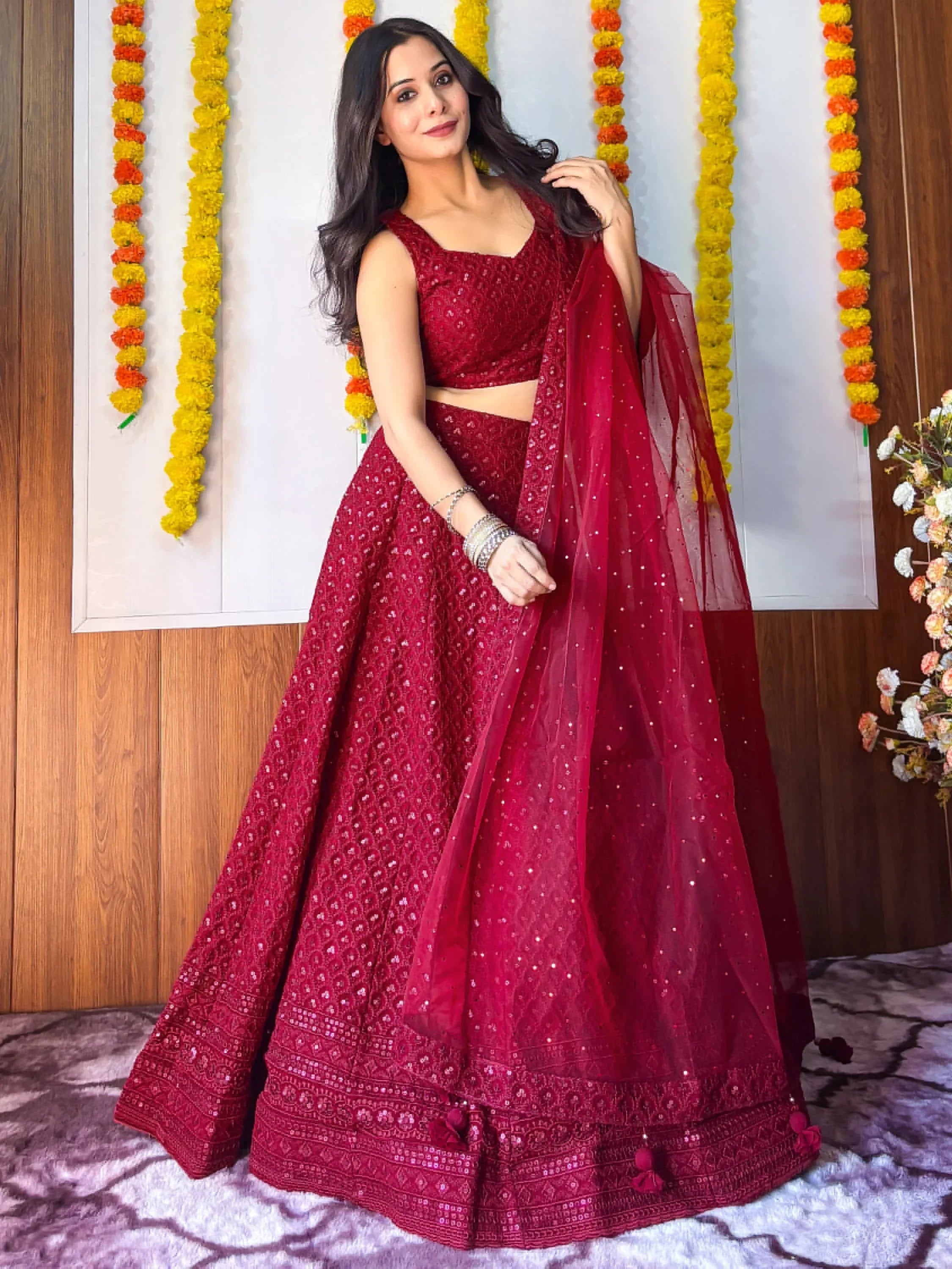 Red embroidered lehenga choli with sheer dupatta, festive Indian ethnic wear for weddings and celebrations