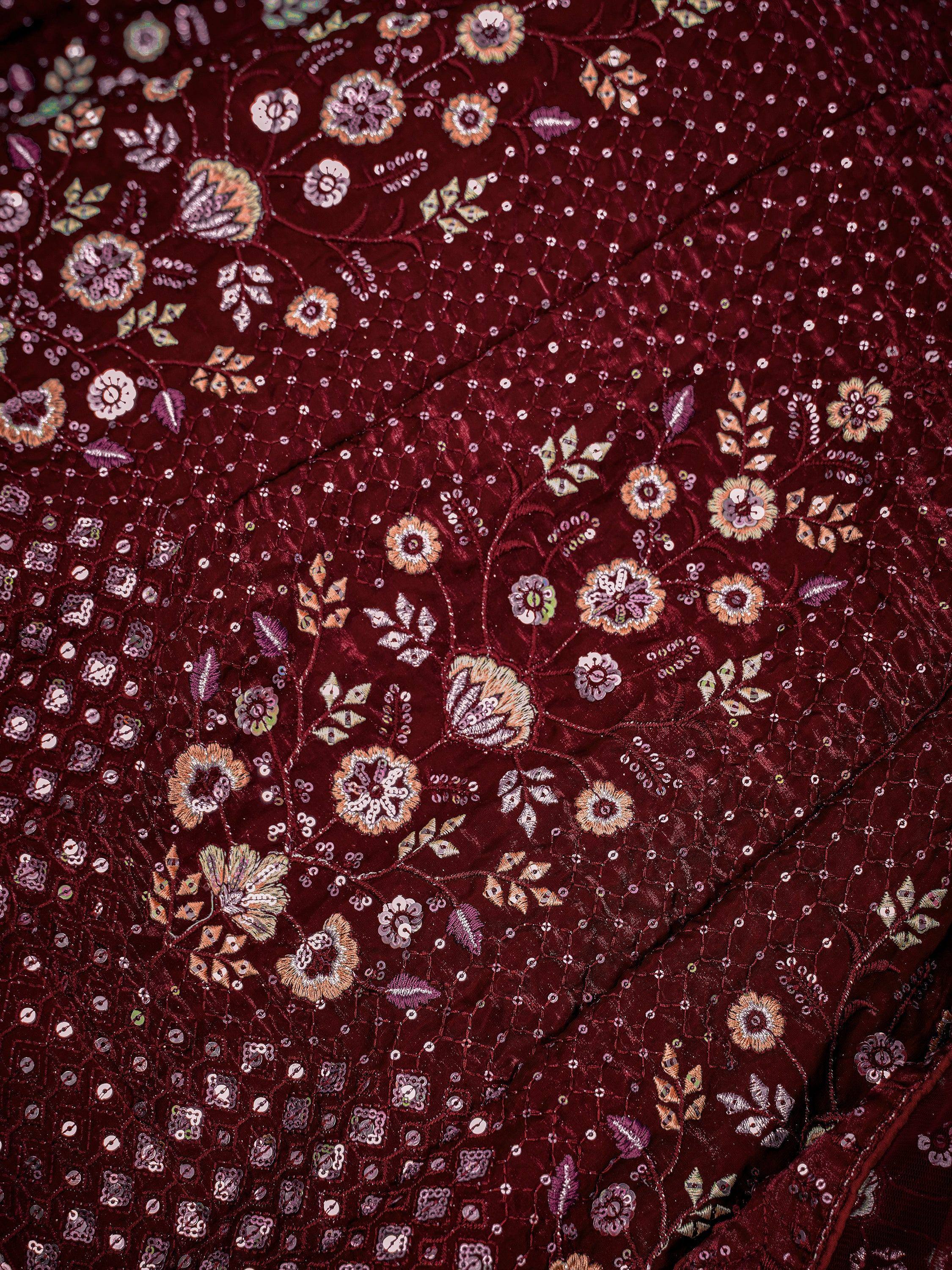 Rich maroon ethnic wear with intricate floral embroidery and sequin detailing for festive occasions