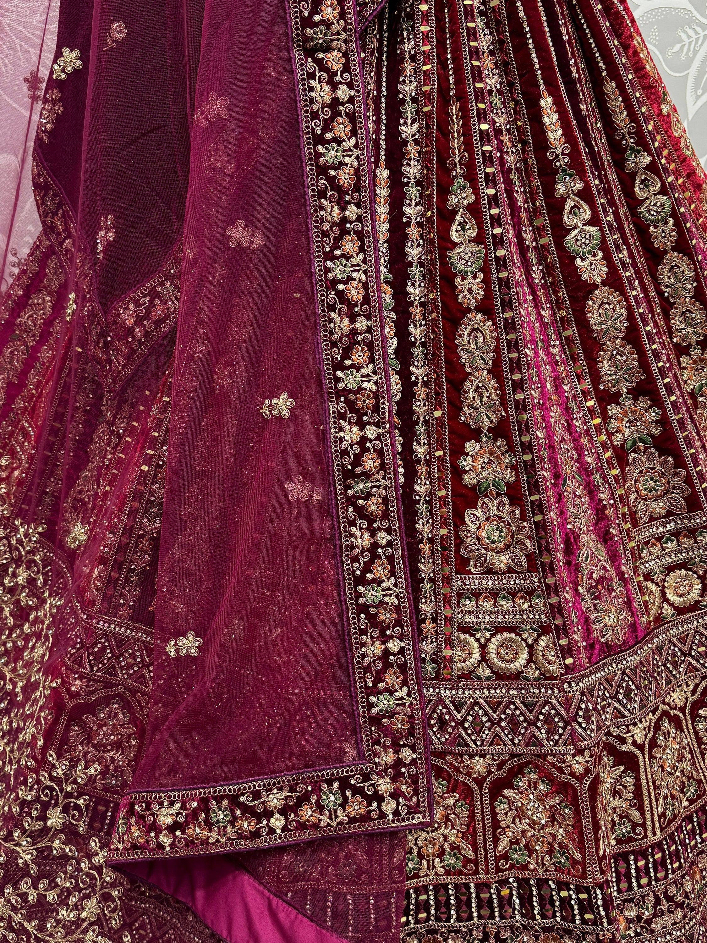 Luxury maroon velvet lehenga choli with intricate gold floral embroidery and embellished dupatta for Indian weddings