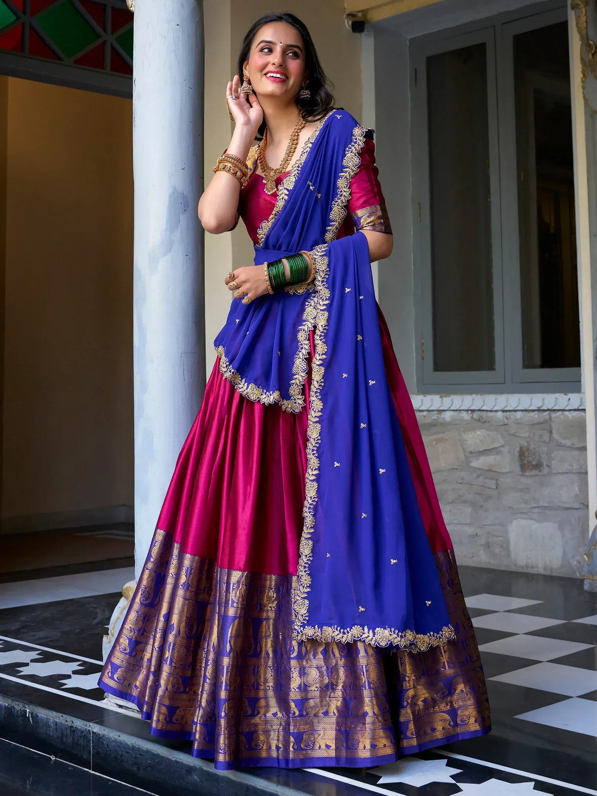 Royal blue and magenta lehenga choli with gold embroidery, perfect for Indian ethnic wear events