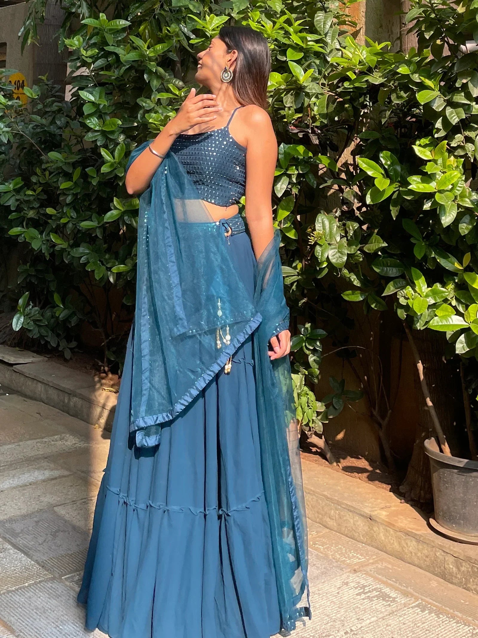 Teal blue sequined lehenga choli with sheer dupatta, perfect for Indian ethnic wear events