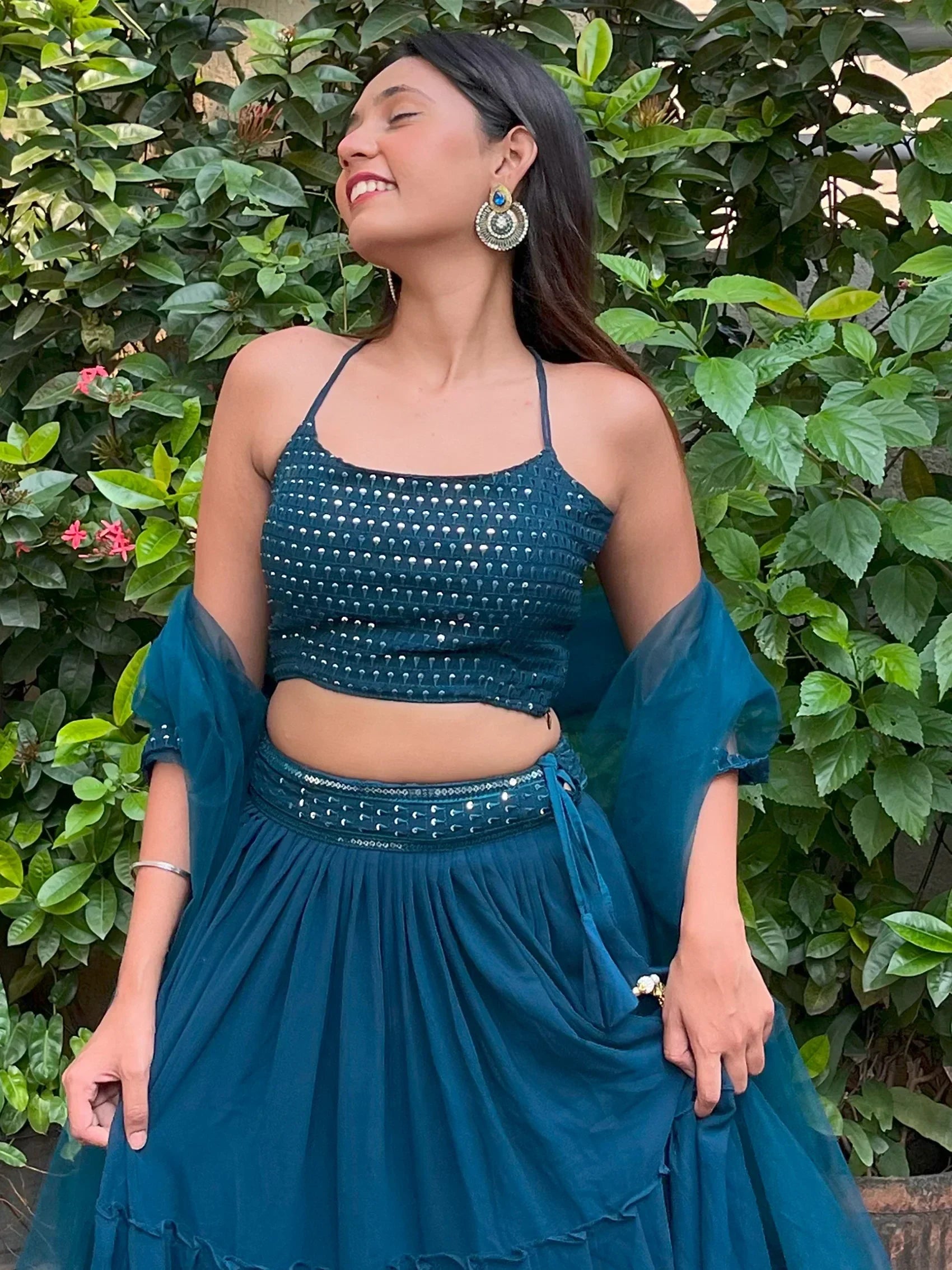 Teal embroidered lehenga choli with sheer sleeves, perfect for Indian ethnic wear occasions
