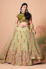 Impressive Pista Green Net Embroidered Wedding Lehenga Choli