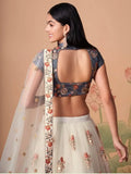 Pretty Ivory Embroidered Net Party Wear Lehenga Choli
