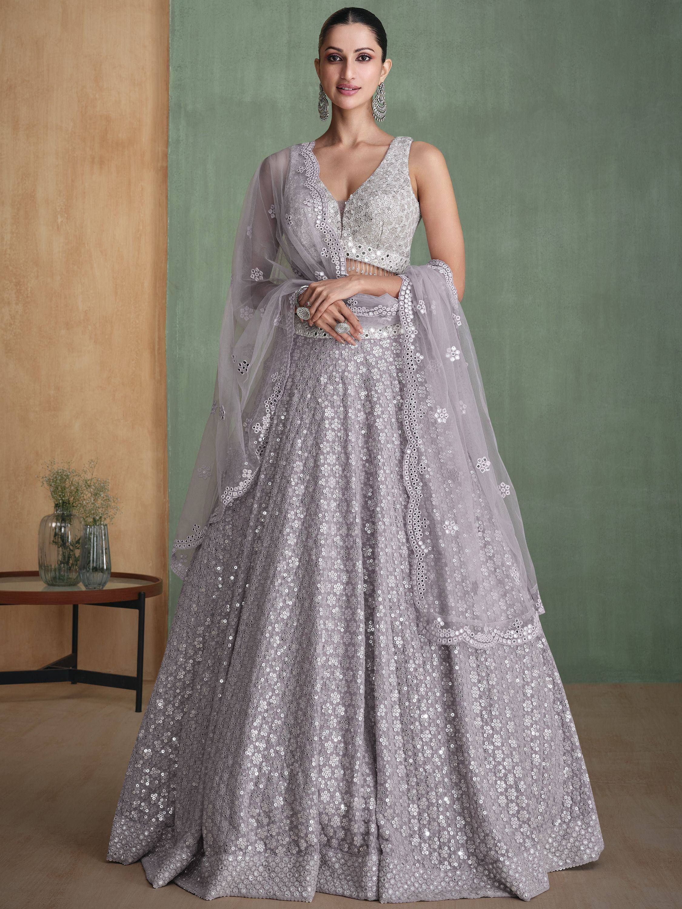 Elegant grey lehenga choli with mirror work and sheer dupatta, perfect for Indian ethnic wear occasions.