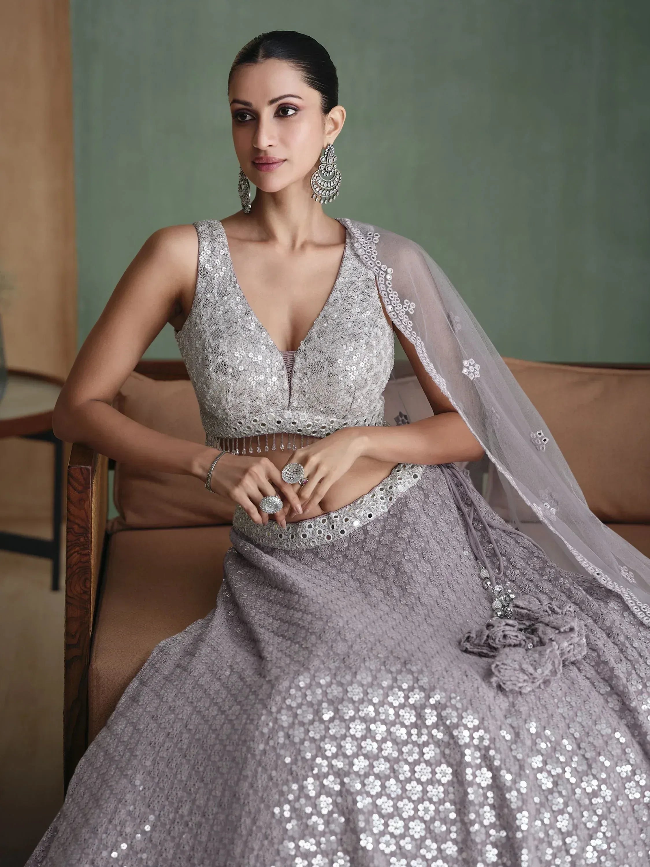 Elegant lavender lehenga choli with sequin embroidery and sheer dupatta, perfect for Indian ethnic occasions.