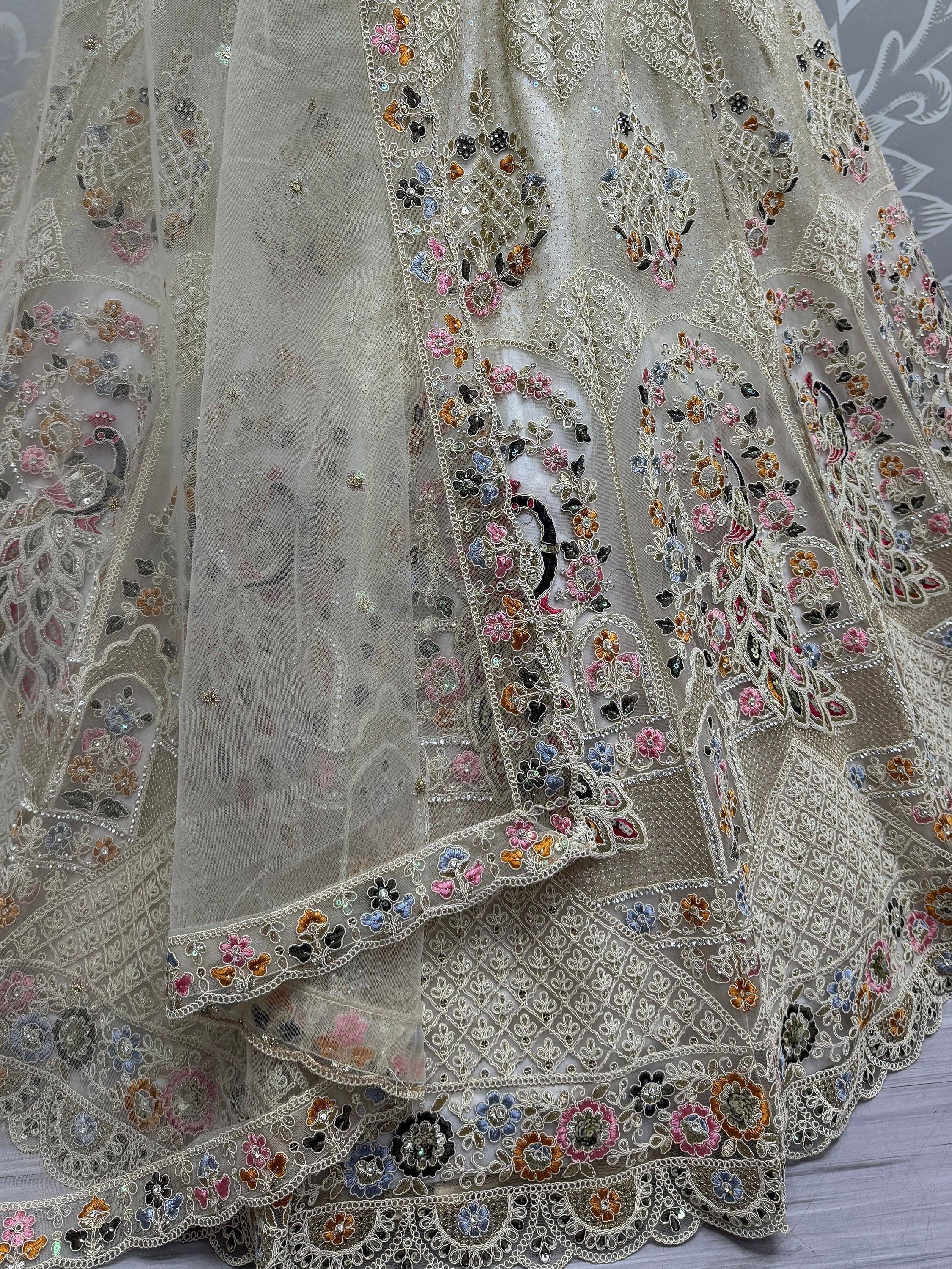Designer lehenga with intricate floral embroidery and sequin work on sheer fabric