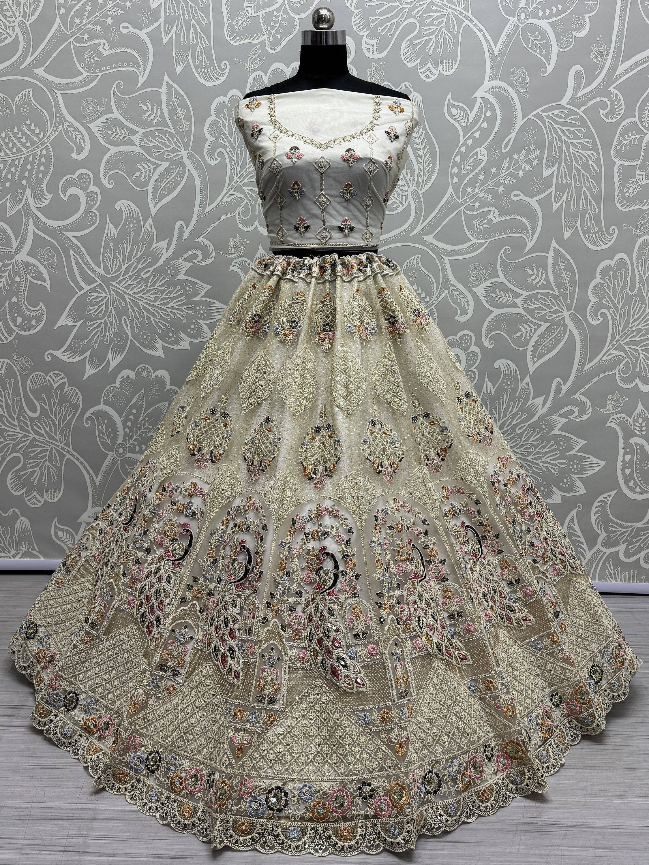 Elegant ivory lehenga choli with peacock embroidery, perfect for Indian weddings and festive occasions.
