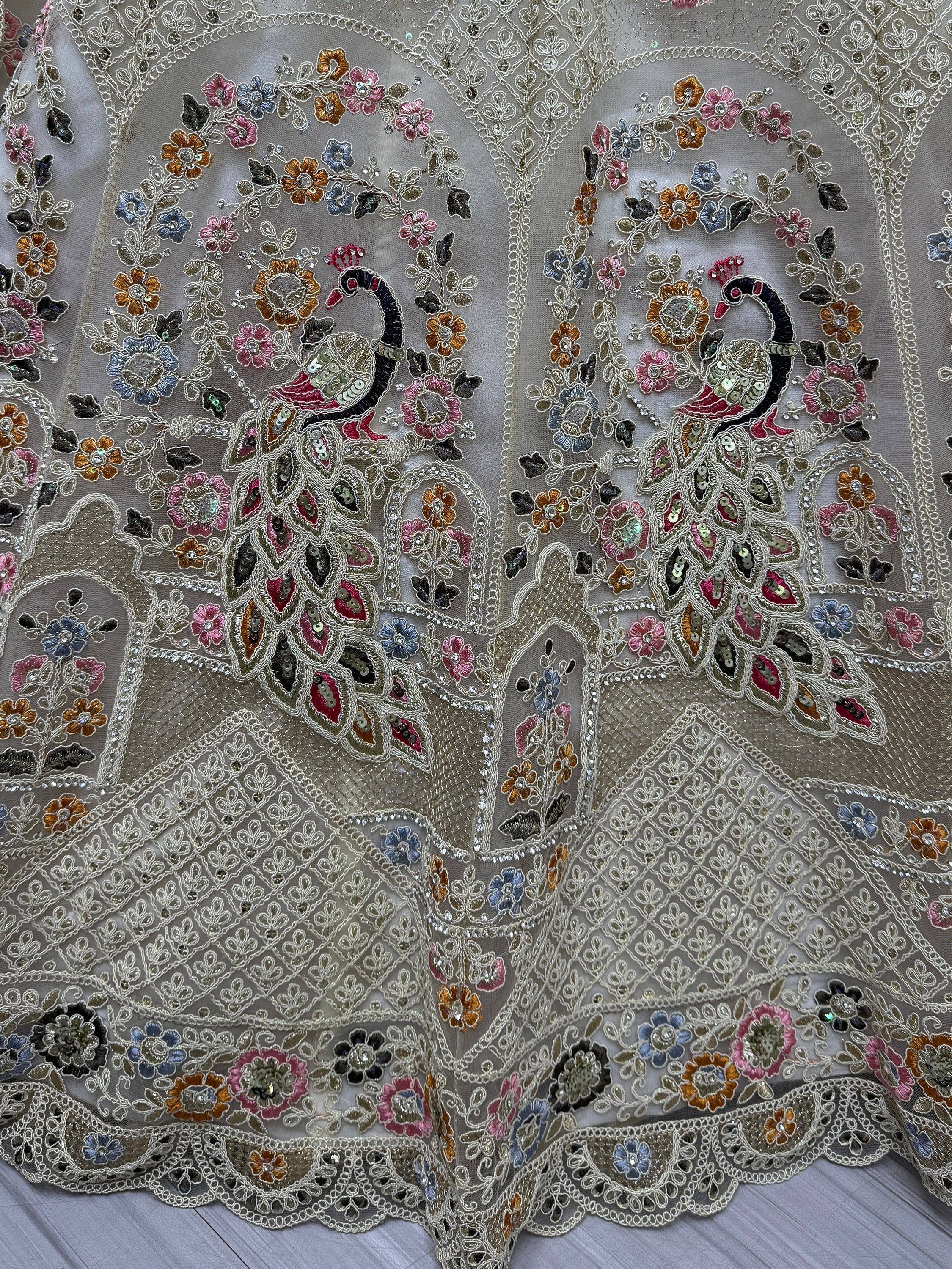 Embroidered peacock and floral design on sheer ethnic fabric with sequins and threadwork