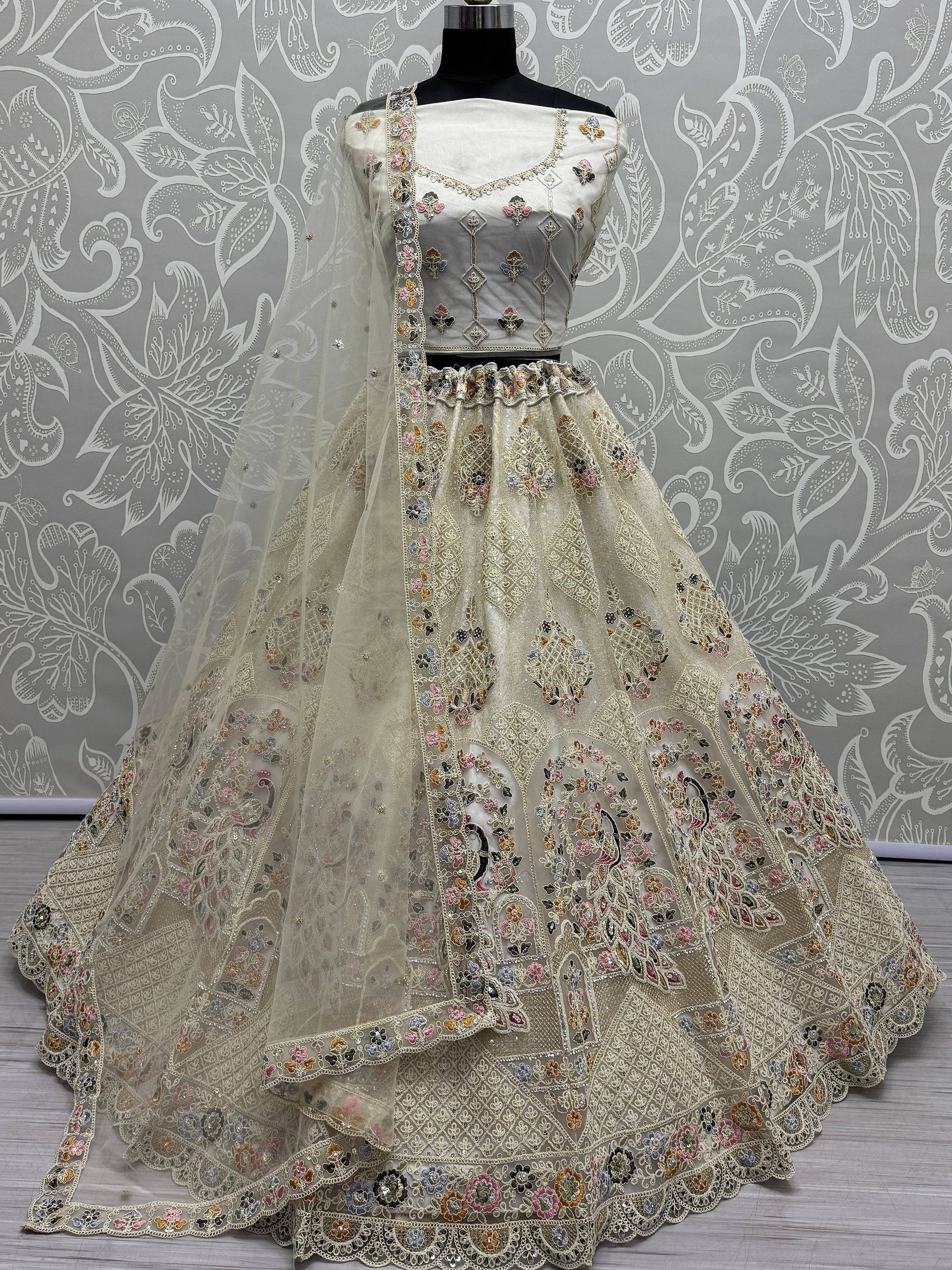 Designer ivory lehenga choli with floral embroidery and net dupatta, perfect for Indian ethnic occasions
