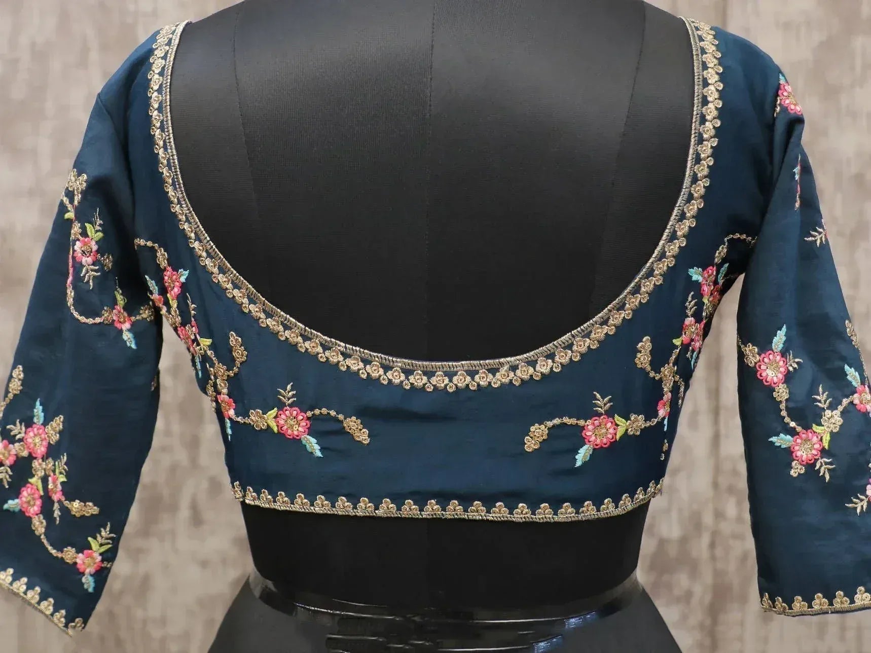 Dark blue embroidered blouse with floral gold detailing, perfect for Indian ethnic wear like lehenga choli.