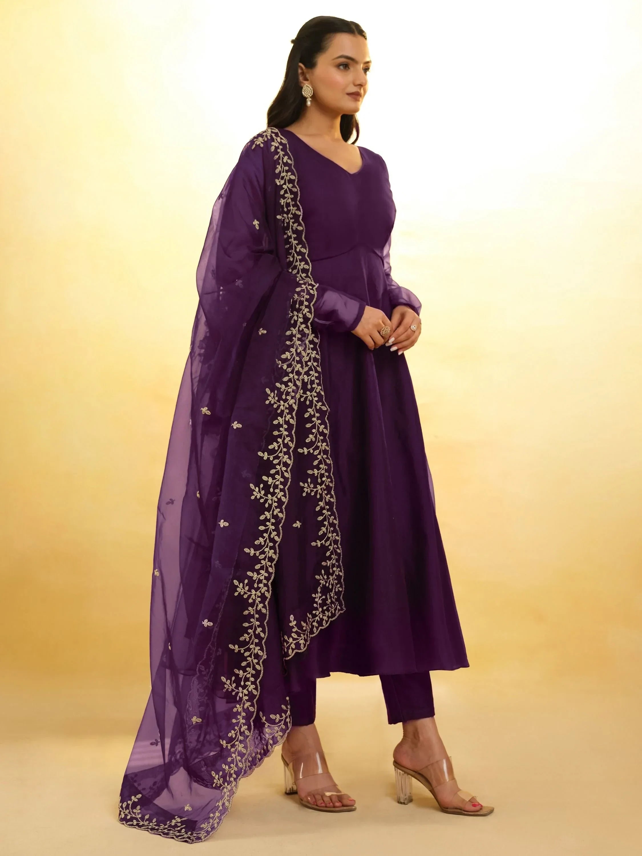 Woman in purple embroidered salwar kameez with sheer dupatta, Indian ethnic wear