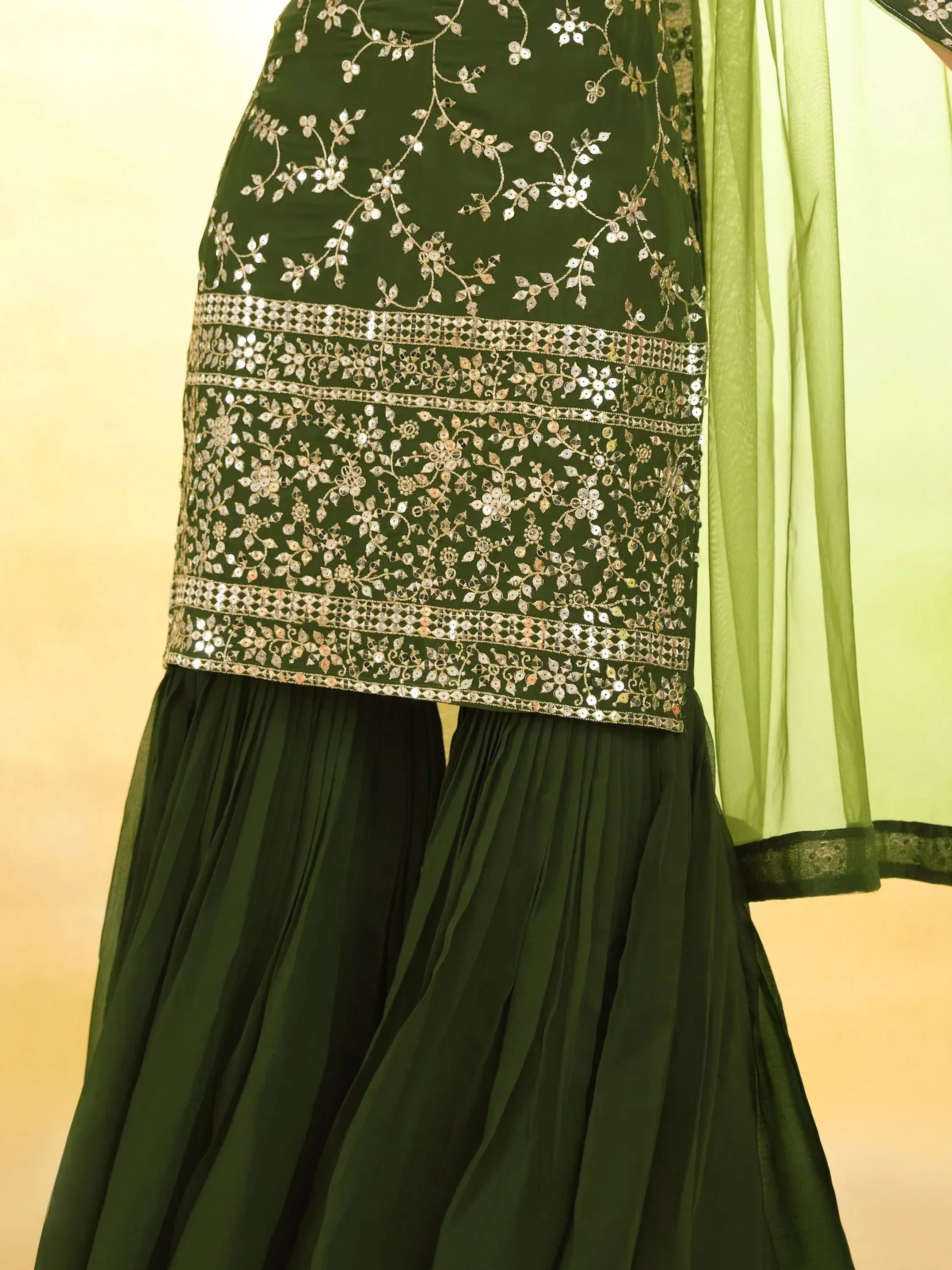 Green embroidered lehenga choli with mirror work and pleated skirt, Indian ethnic wear