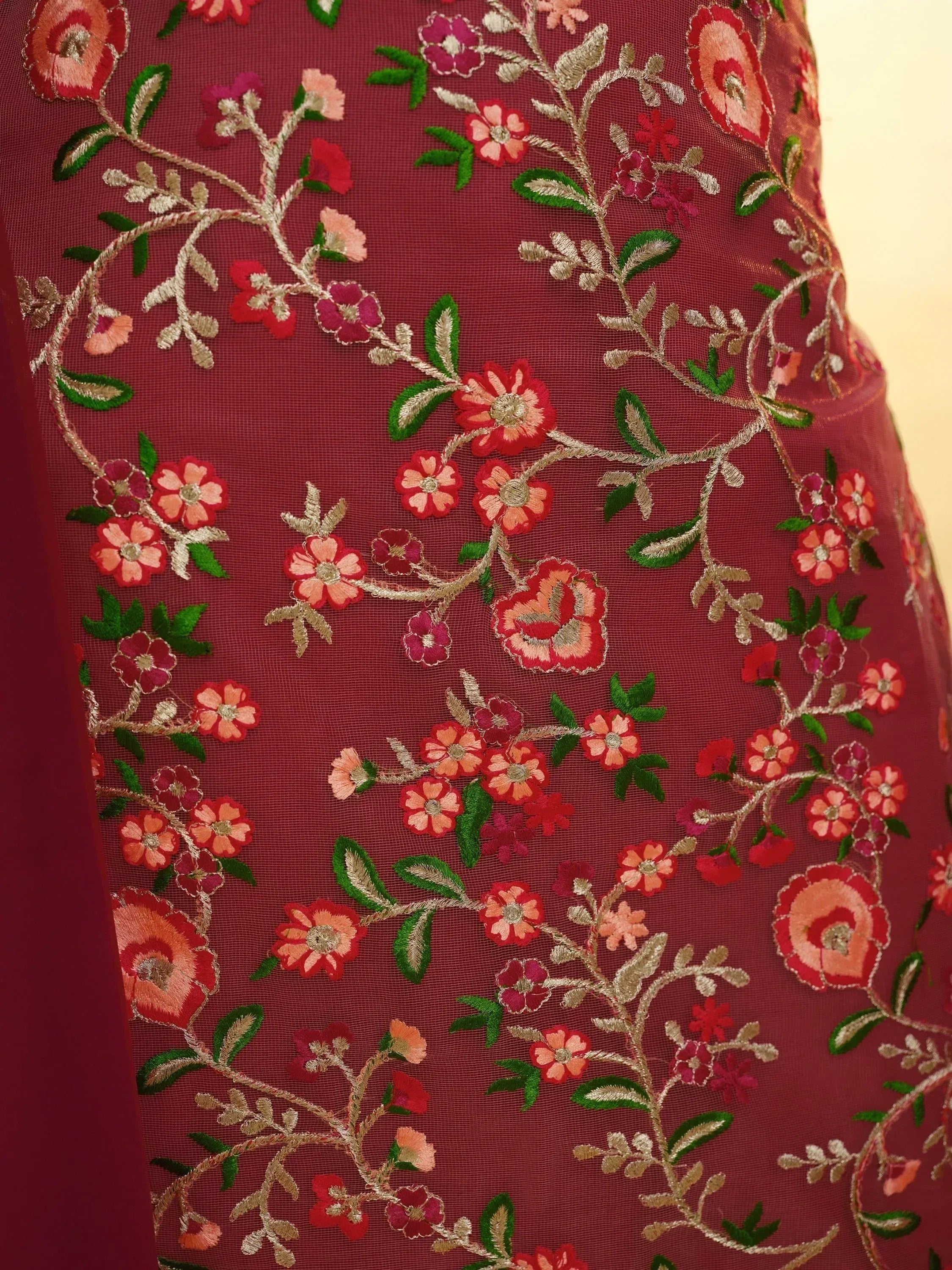 Maroon net fabric with colorful floral embroidery, Indian ethnic wear textile detail