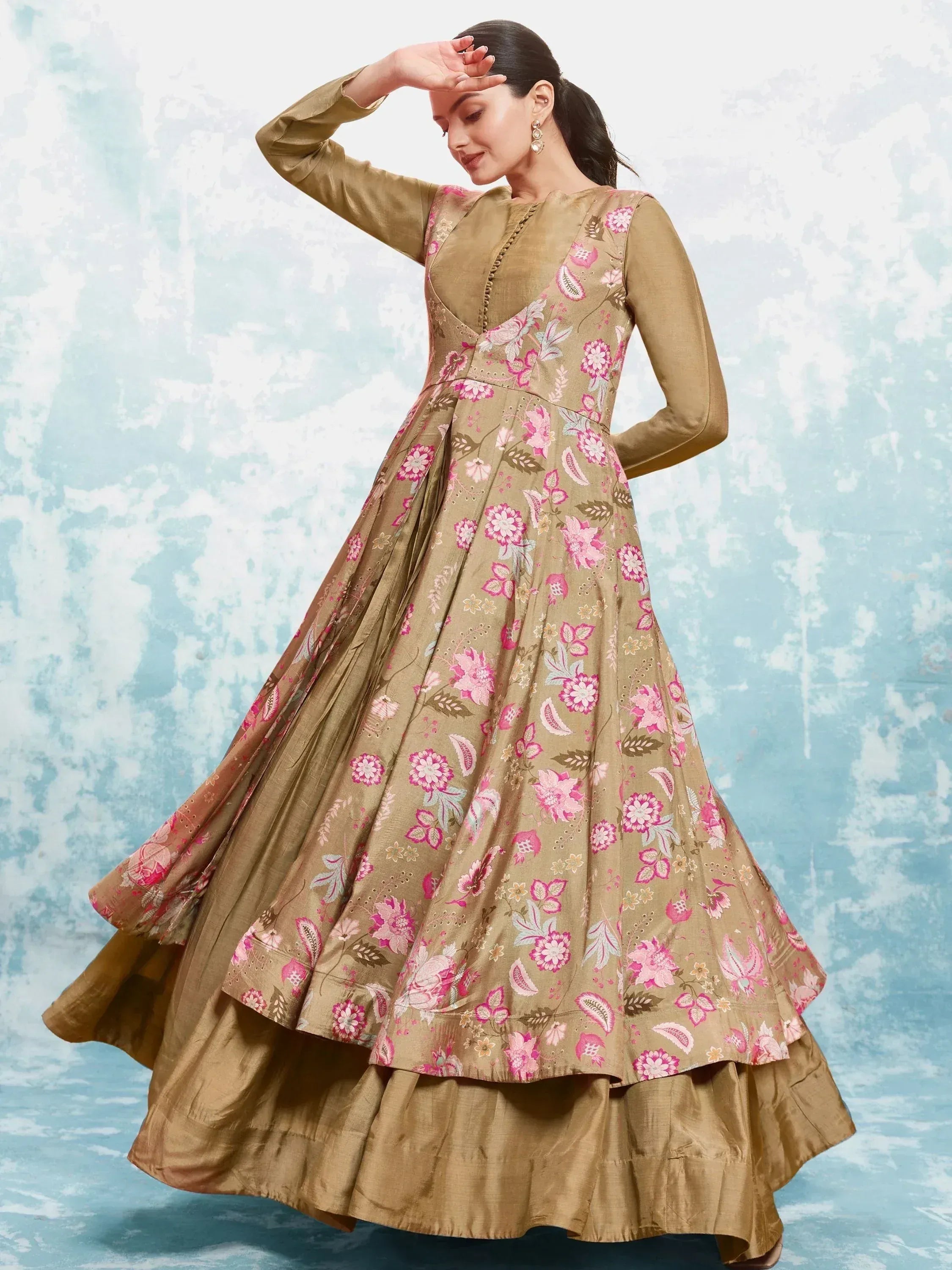 Woman in olive green floral anarkali with pink print, perfect for Indian ethnic wear occasions.