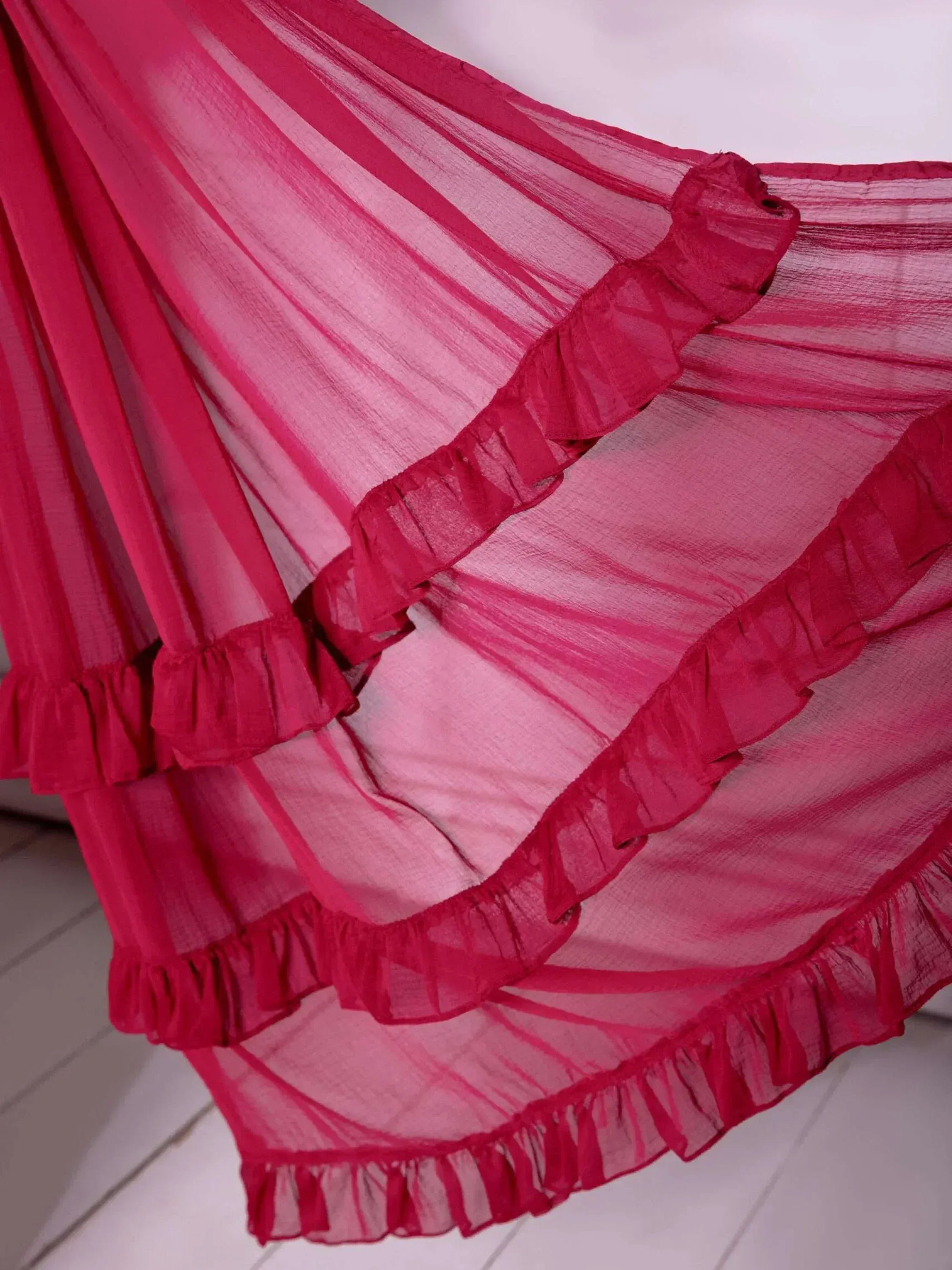 Pink sheer ethnic gown with ruffled layers, perfect for Indian festive wear