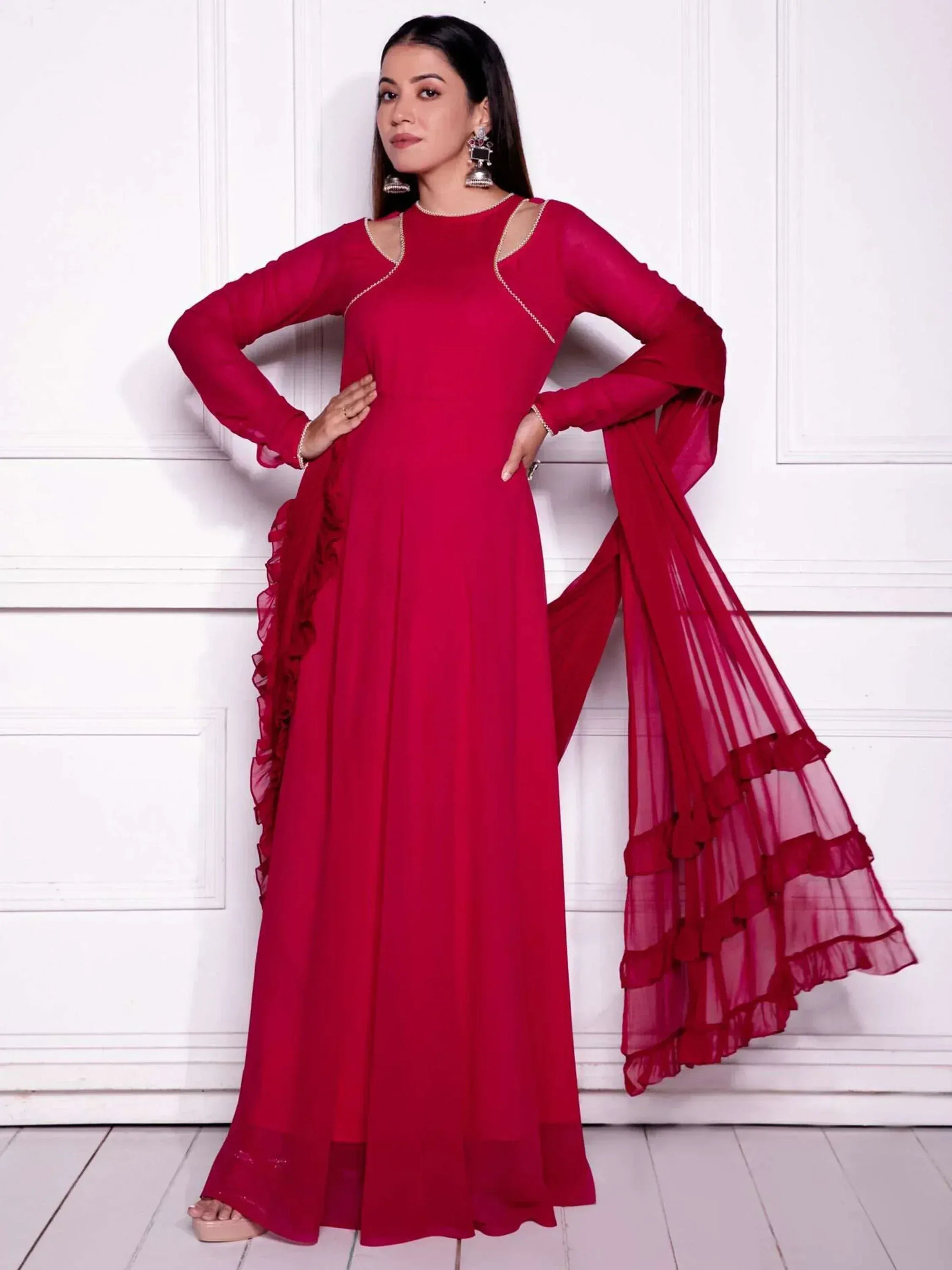 Red ethnic gown with ruffled sleeves and dupatta, perfect for Indian occasions