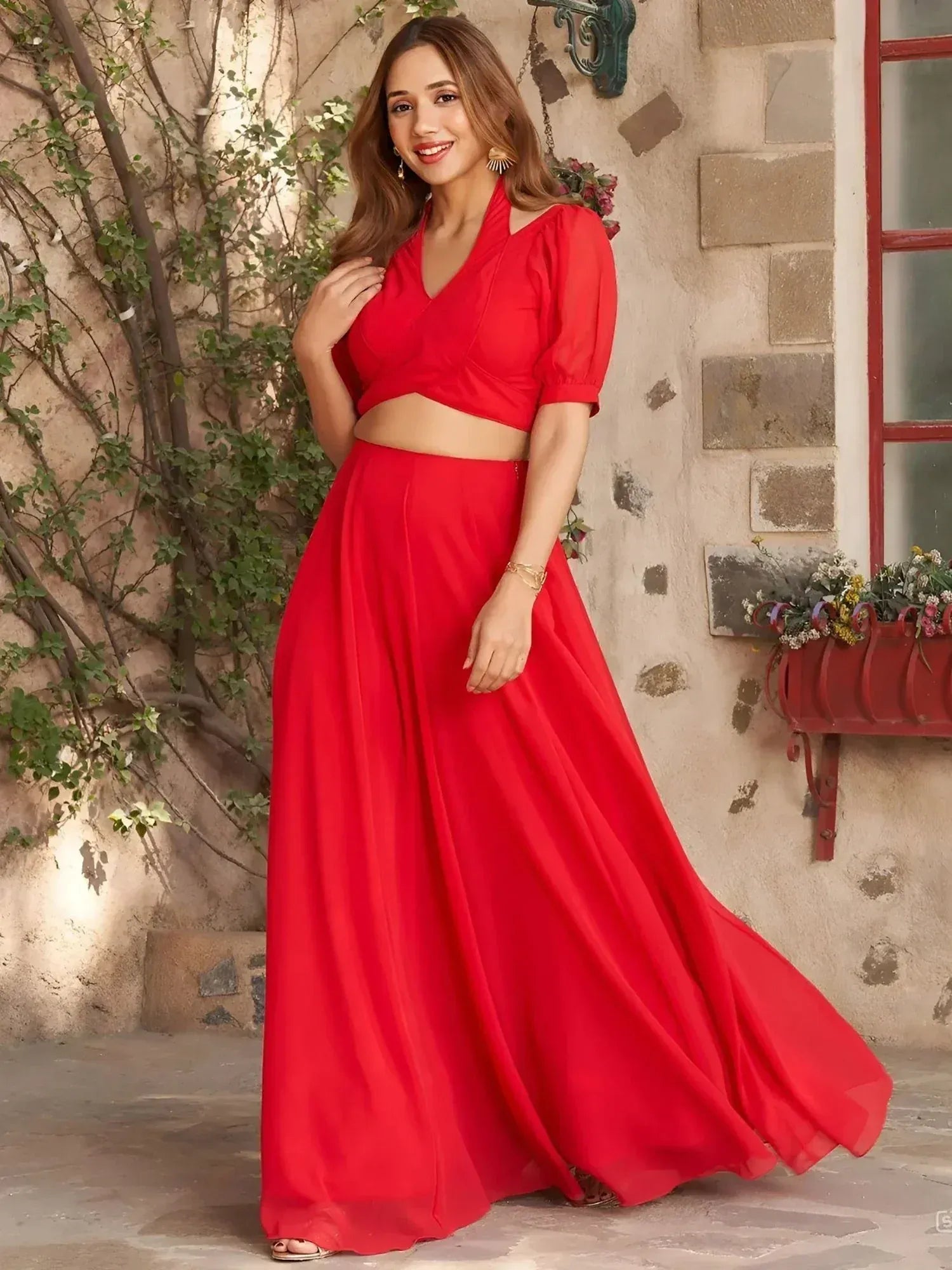 Vibrant red ethnic gown with puff sleeves and flared skirt, perfect for Indian occasions