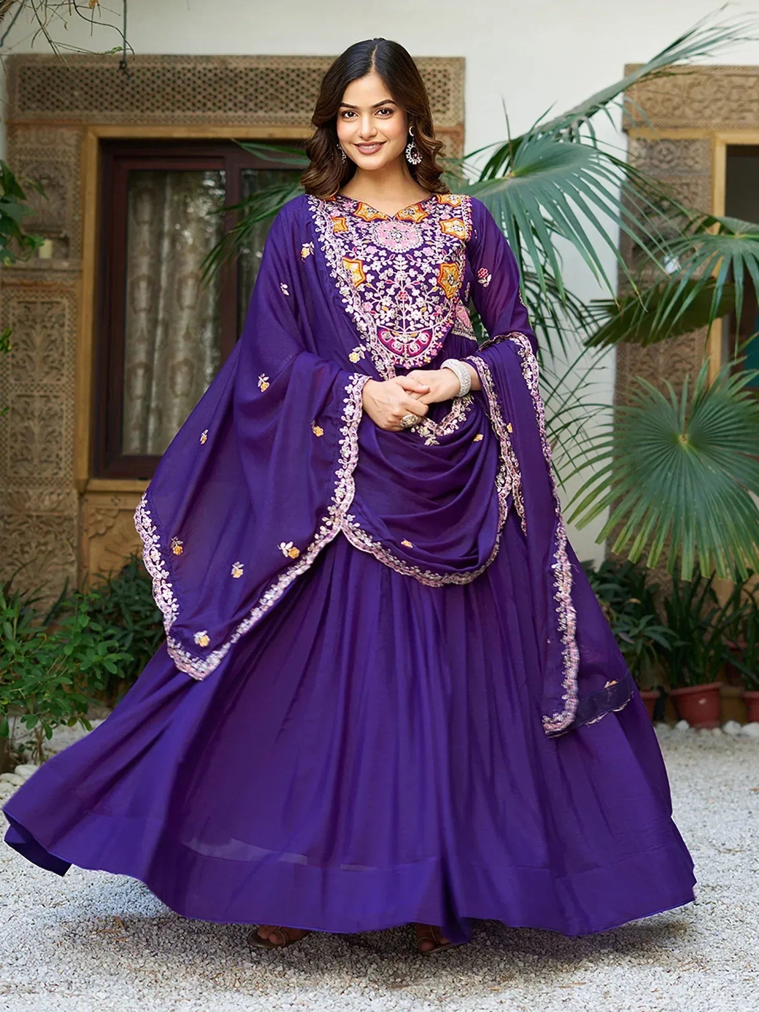 Purple embroidered Indian anarkali suit with floral detailing, perfect for festive occasions