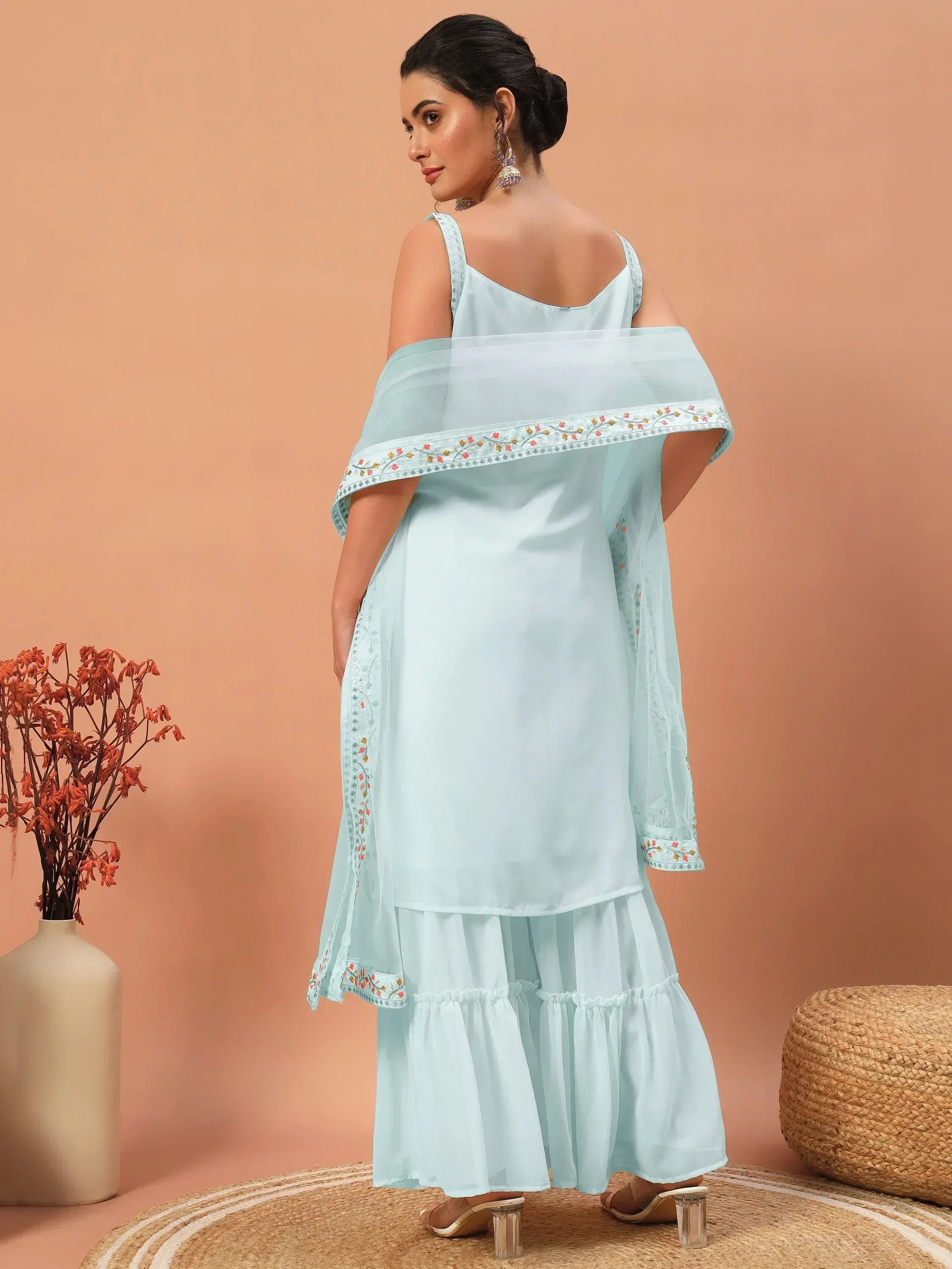 Light blue embroidered ethnic gown with ruffled skirt and sheer dupatta, perfect for Indian occasions