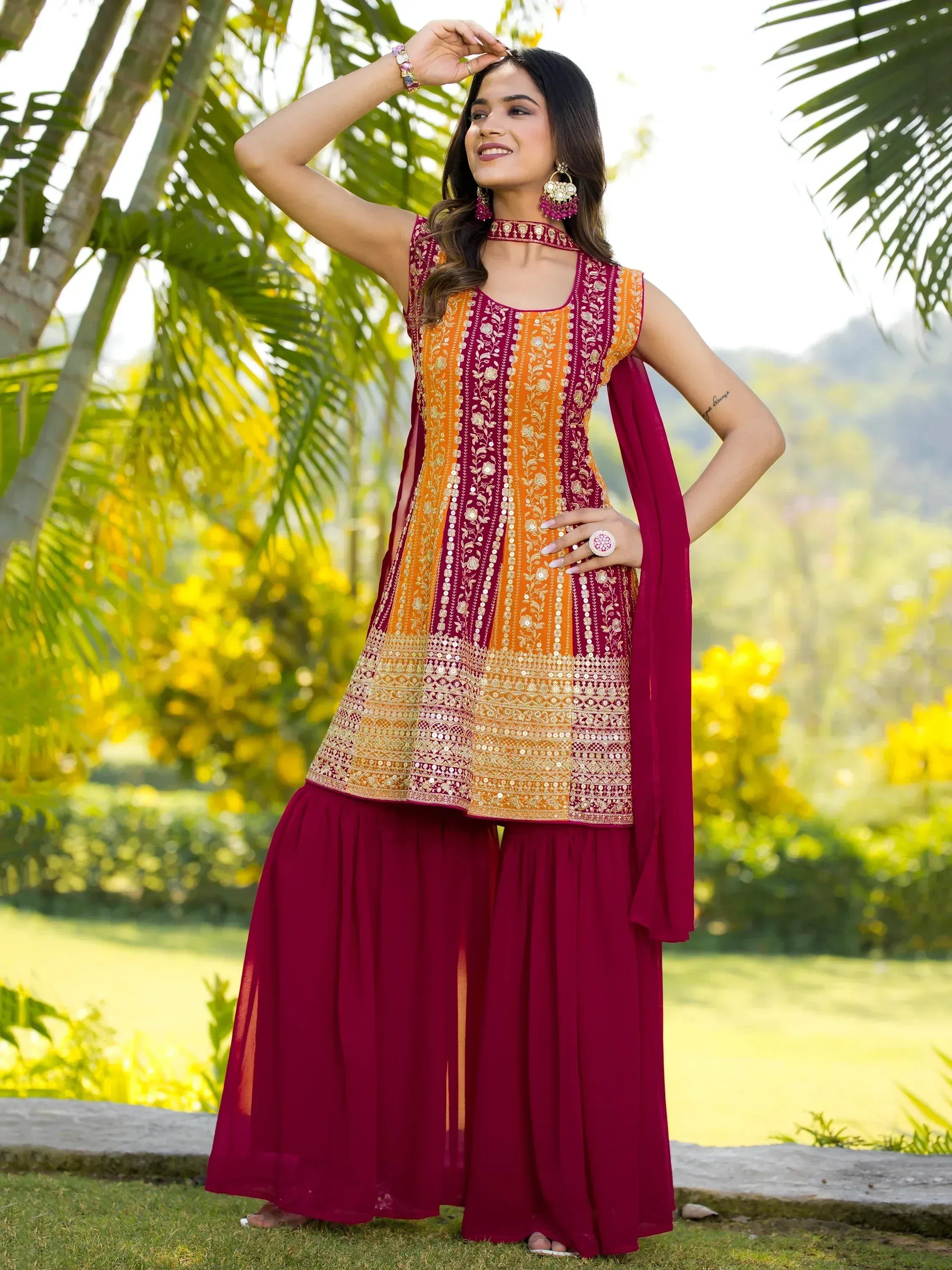 Maroon and orange embroidered ethnic salwar kameez with floral motifs, perfect for festive occasions