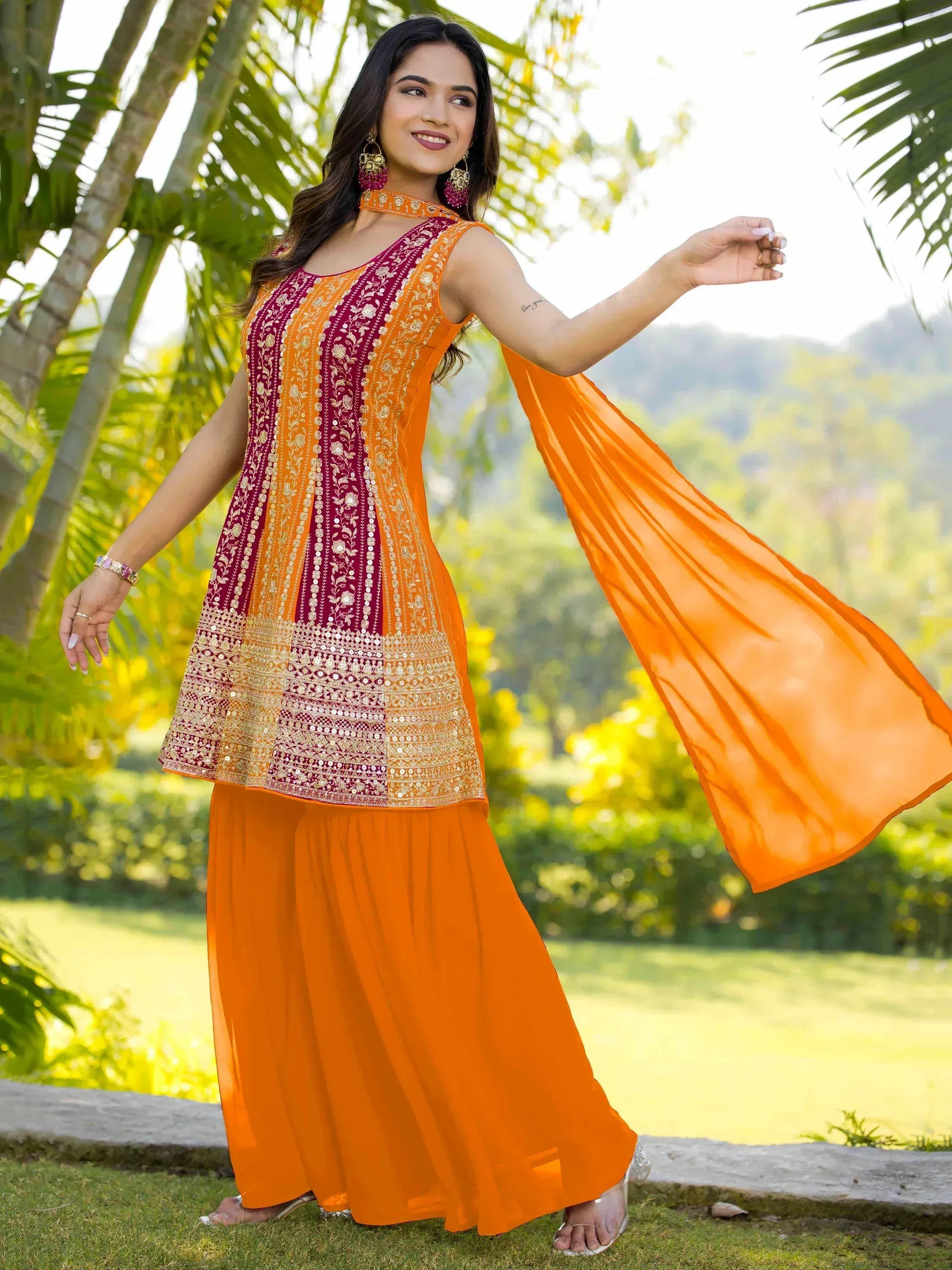 Orange and maroon embroidered ethnic gown with matching dupatta, perfect for Indian occasions