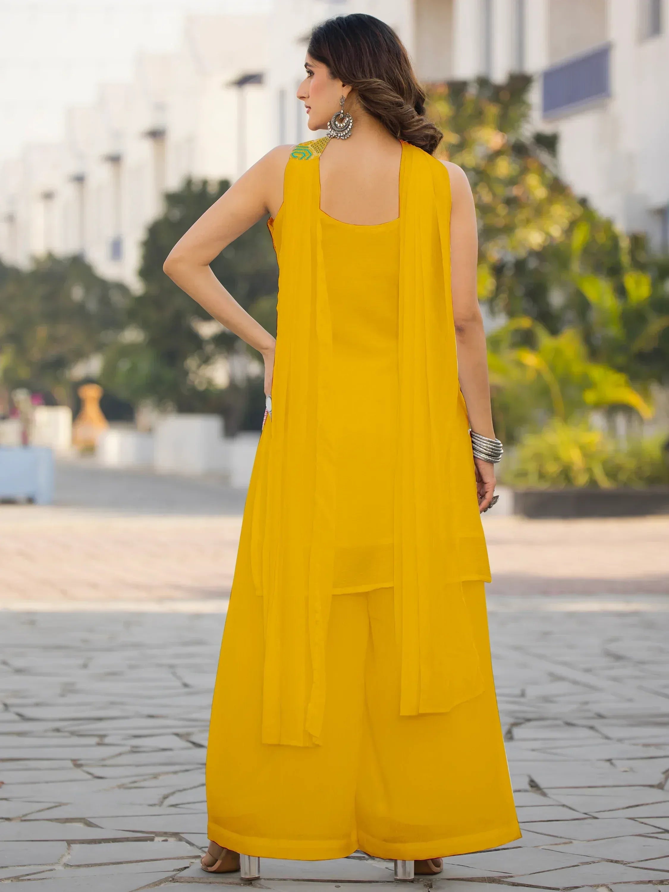 Yellow ethnic palazzo suit with embroidered neckline and dupatta, perfect for Indian occasions