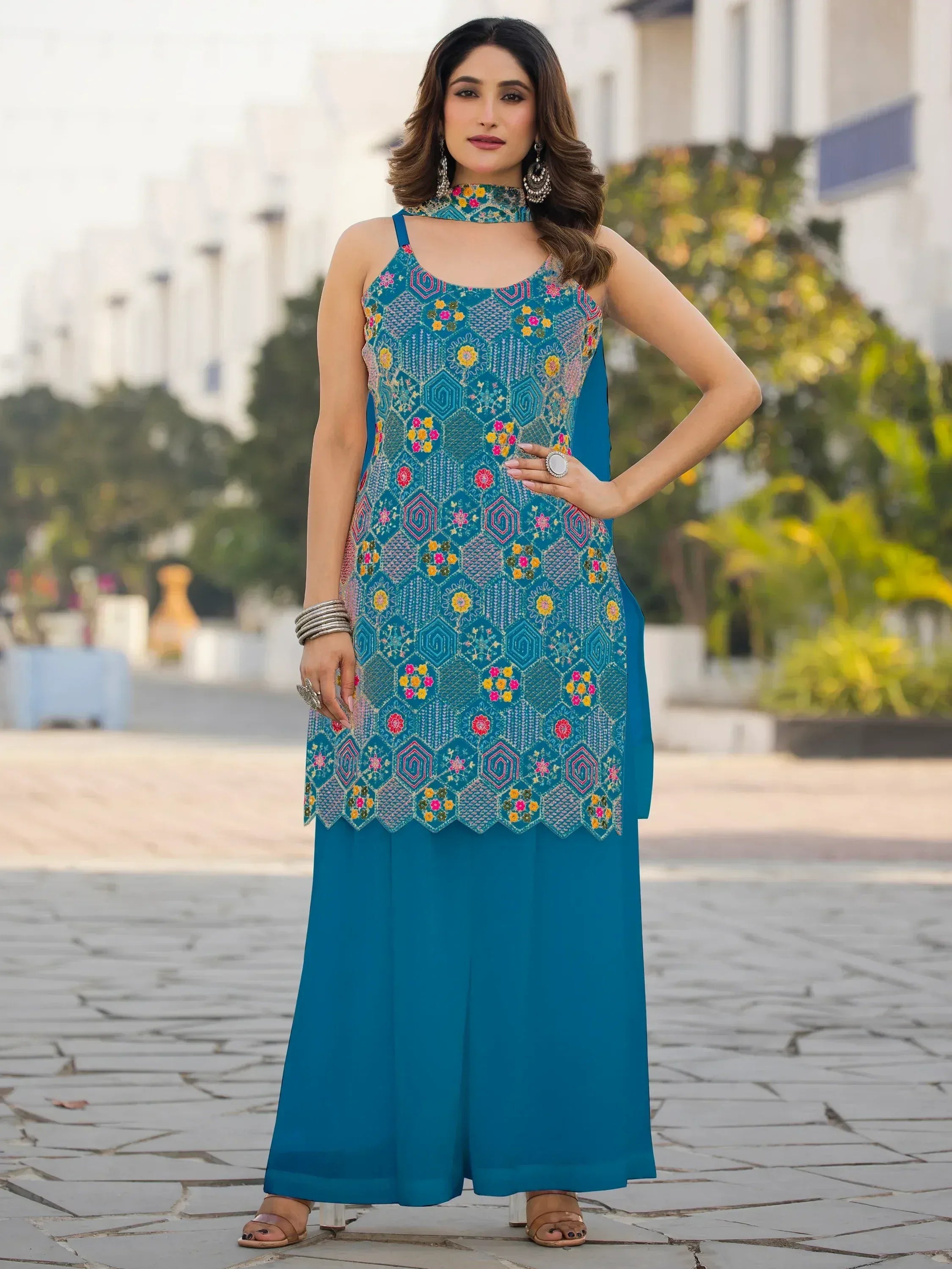 Teal embroidered ethnic kurti with palazzo pants, floral and geometric patterns, choker neck design