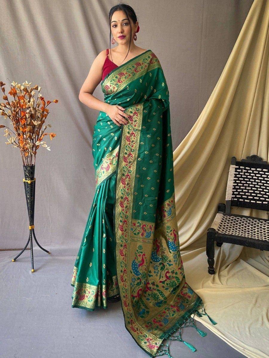 Emerald green silk saree with peacock and floral border, paired with red blouse, ideal for Indian ethnic occasions