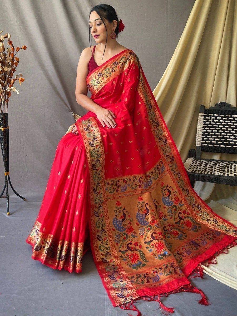 Red ethnic saree with peacock print and gold border, styled with blouse for Indian occasions
