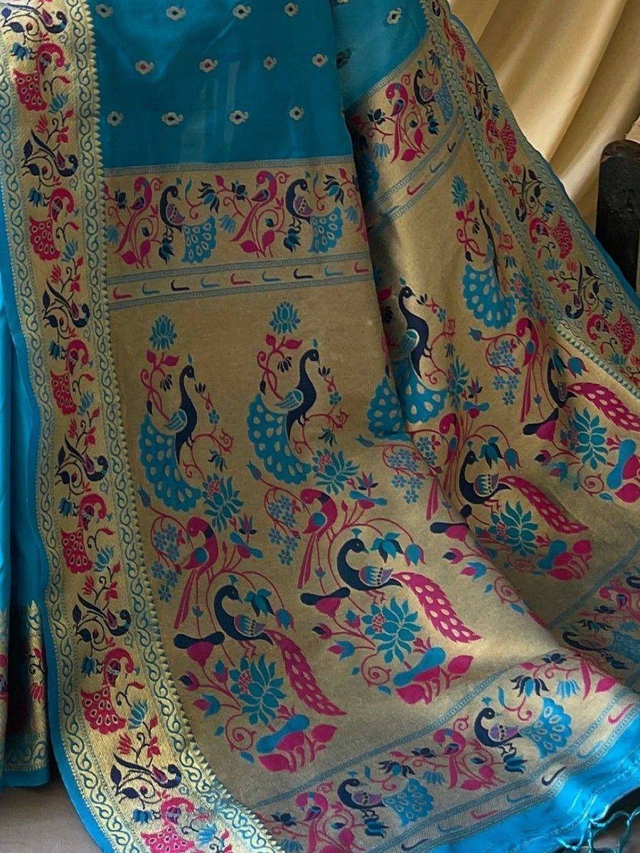 Blue and gold ethnic saree with peacock and floral print, perfect for Indian festive wear