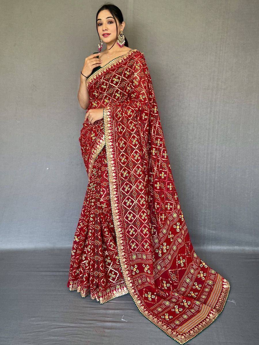 Red embroidered saree with gold patterns, perfect for Indian ethnic wear and festive occasions.