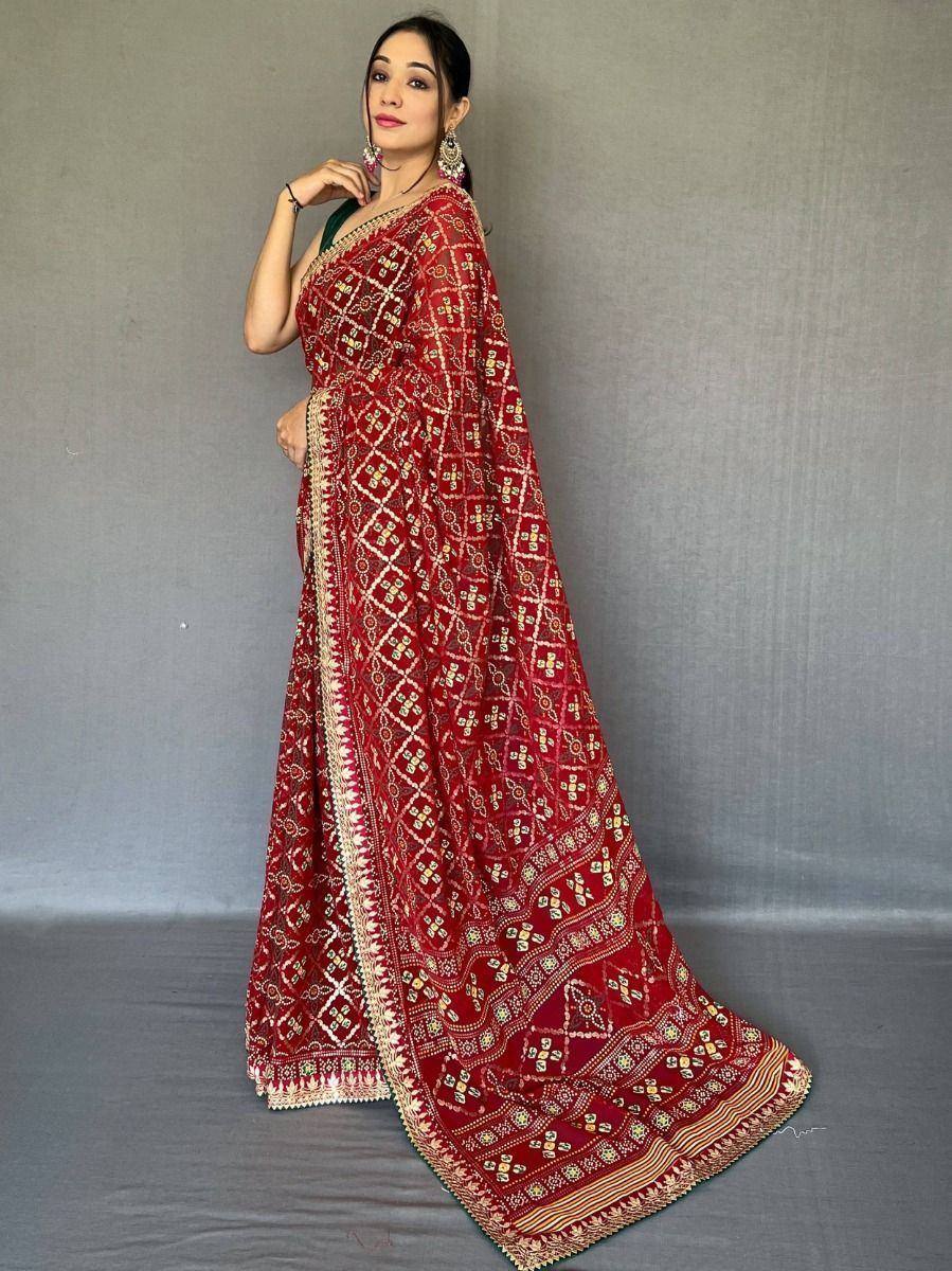 Red embroidered saree with gold geometric patterns, perfect for Indian ethnic wear occasions